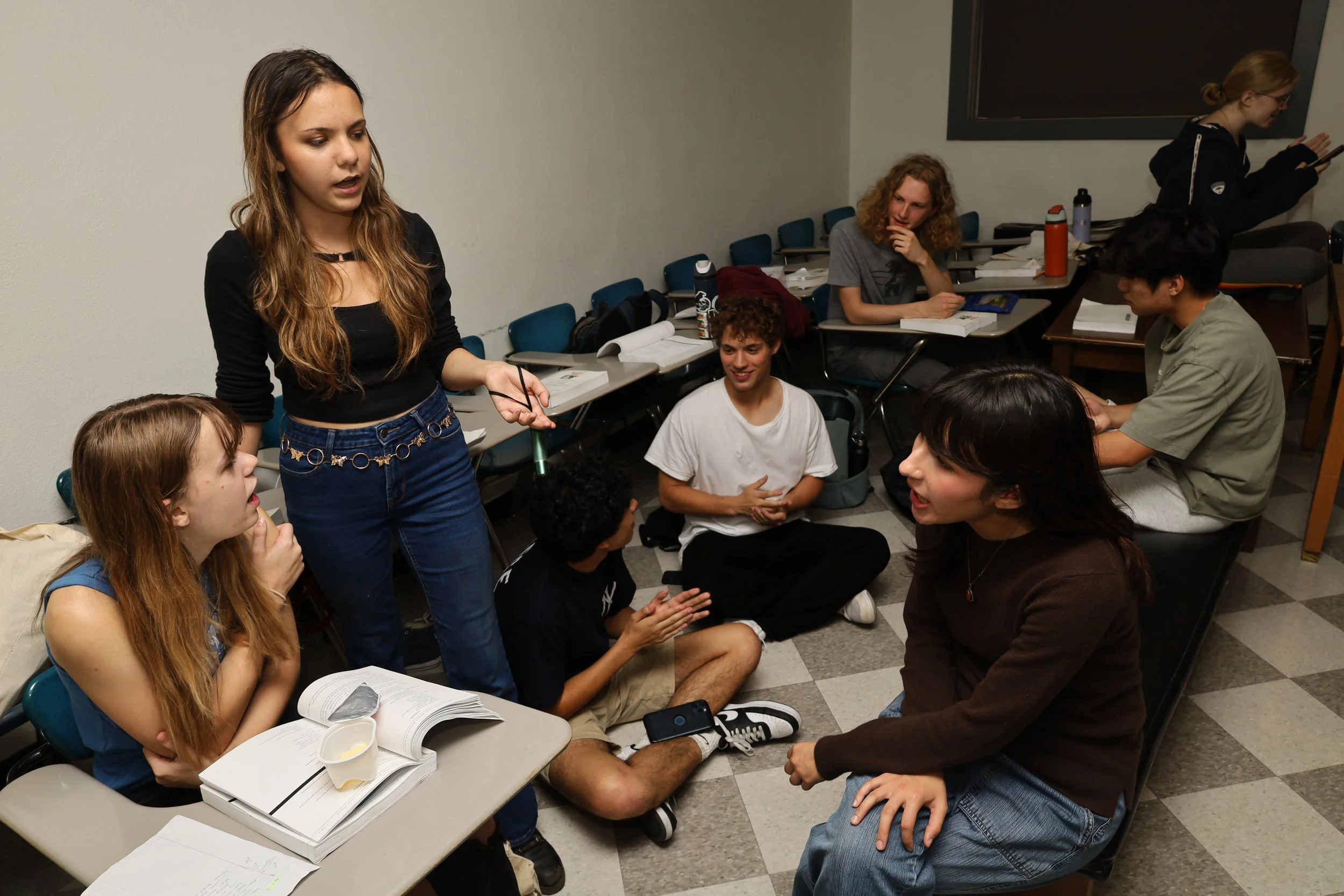 Cast members talk while on a short break from rehearsal on Oct. 16 at Parlin Hall. 