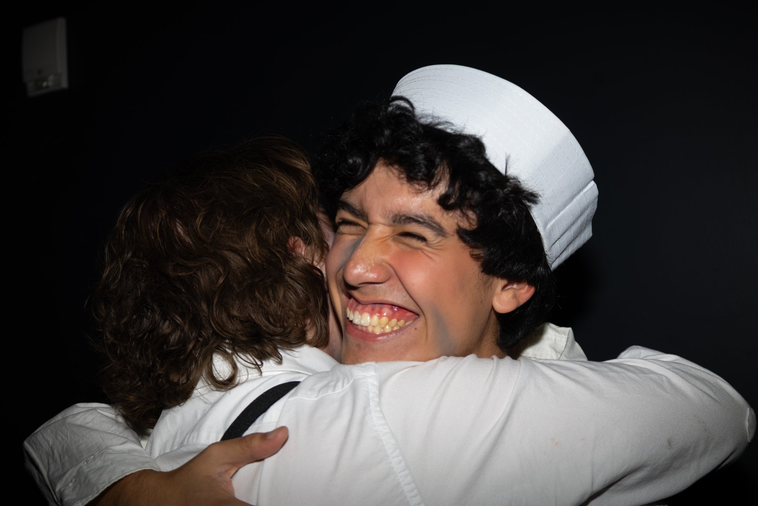 Jason Robalino hugs castmate Aidan Jones at opening night on Oct. 30. 