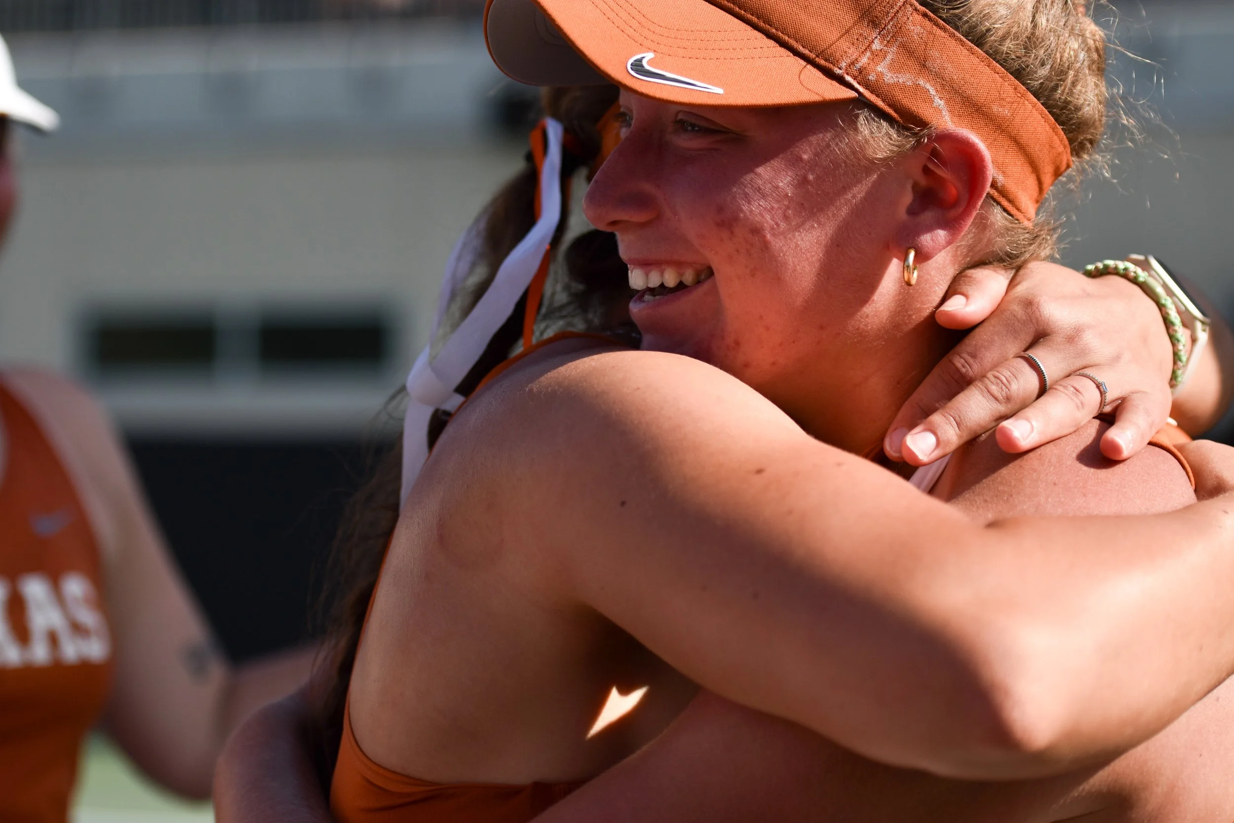 Ashton Bowers hugs her teammate after winning against Georgia at the Texas vs. Georgia game on April 11, 2025.