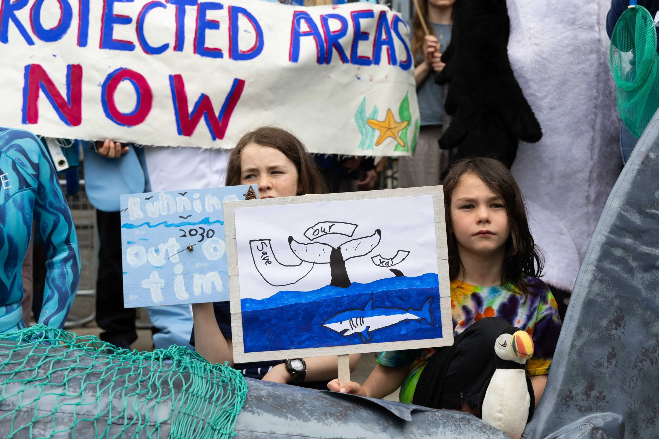 Protesters hold up signs at the Rally 4 Ireland Seas in Dublin, Ireland on May 21, 2026.
