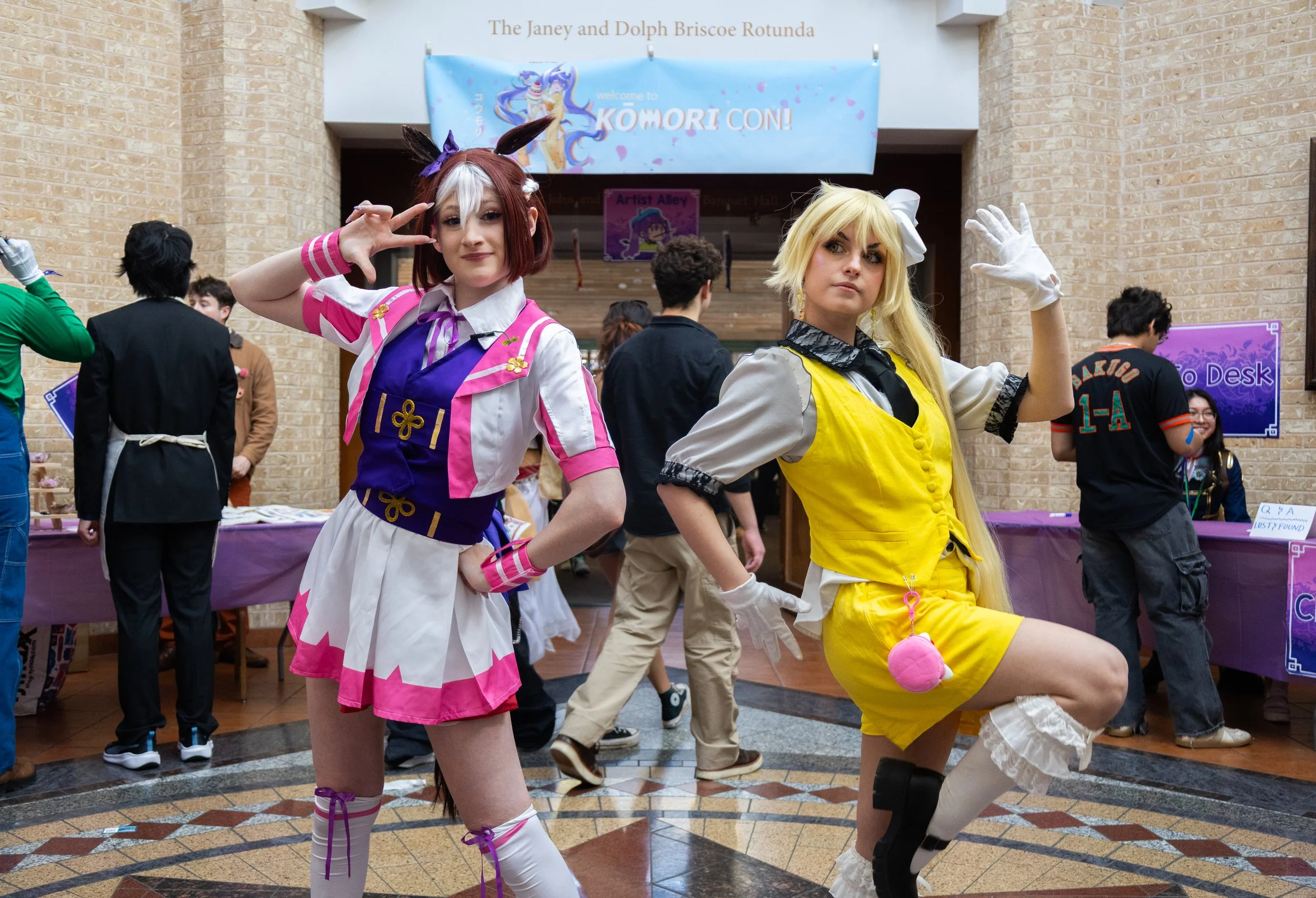Cosplayer "Bunny," left, and Lia, right, pose for a portrait at  KumoriCon on Feb. 7, 2026.