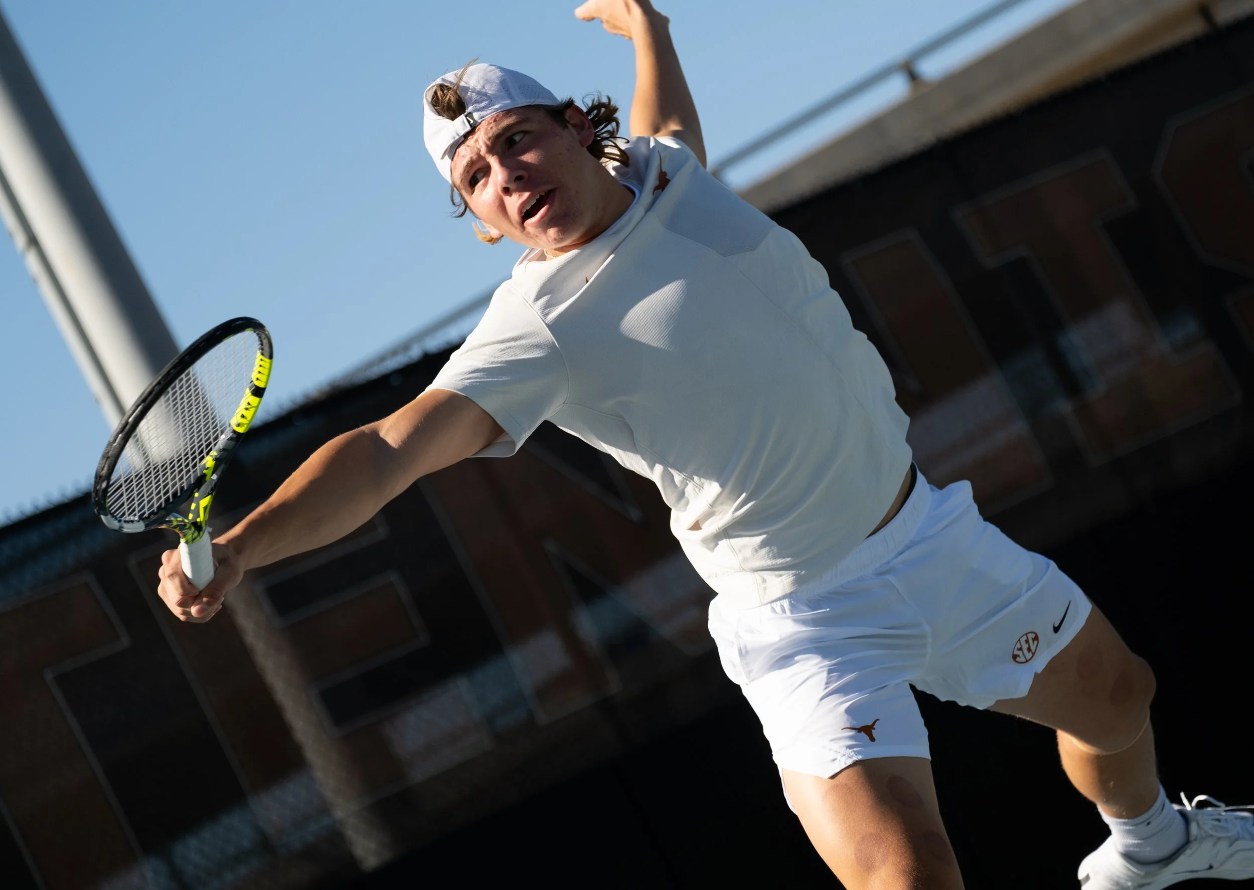 Freshman Mariano Dedura-Palomero prepares to hit ball during a singles match against Virginia on Sunday, Jan. 18.