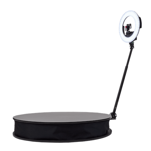 Ring light with adjustable stand and a flat surface.