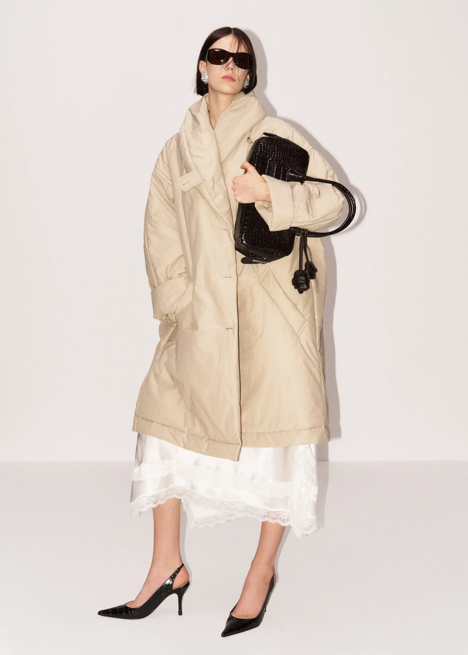 Magda Butrym, oversized coat with shawl collar.
