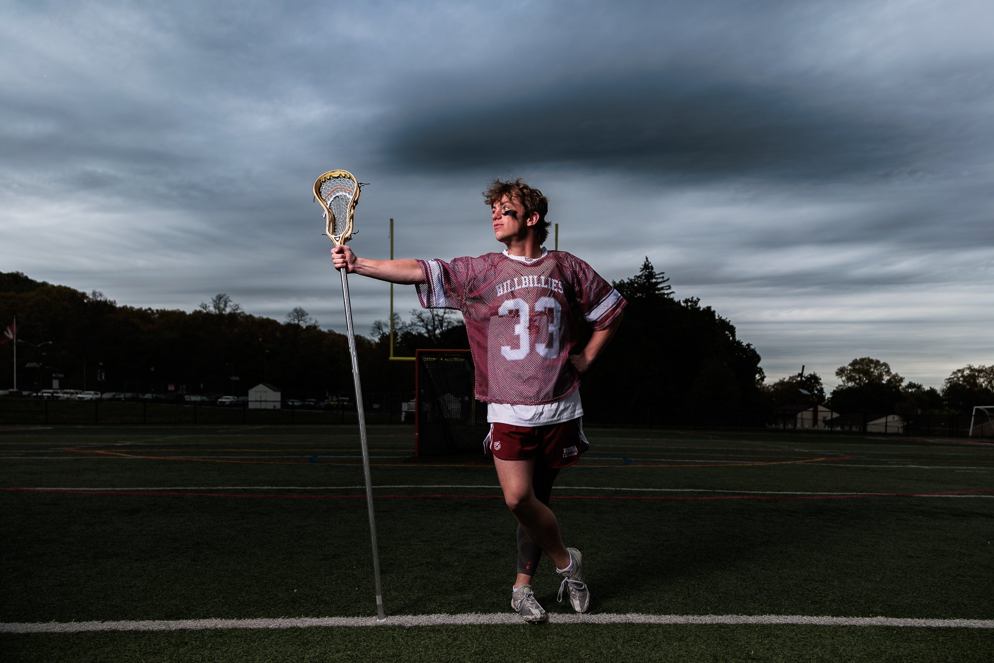 Verona, NJ Lacrosse portrait dramatic sky with flash at Verona High School