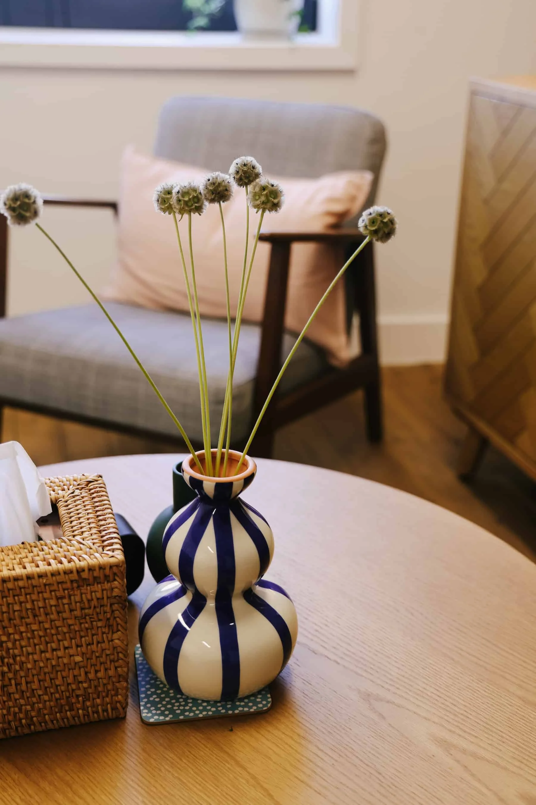 Close-up of therapy room table with flowers and seating in consulting room