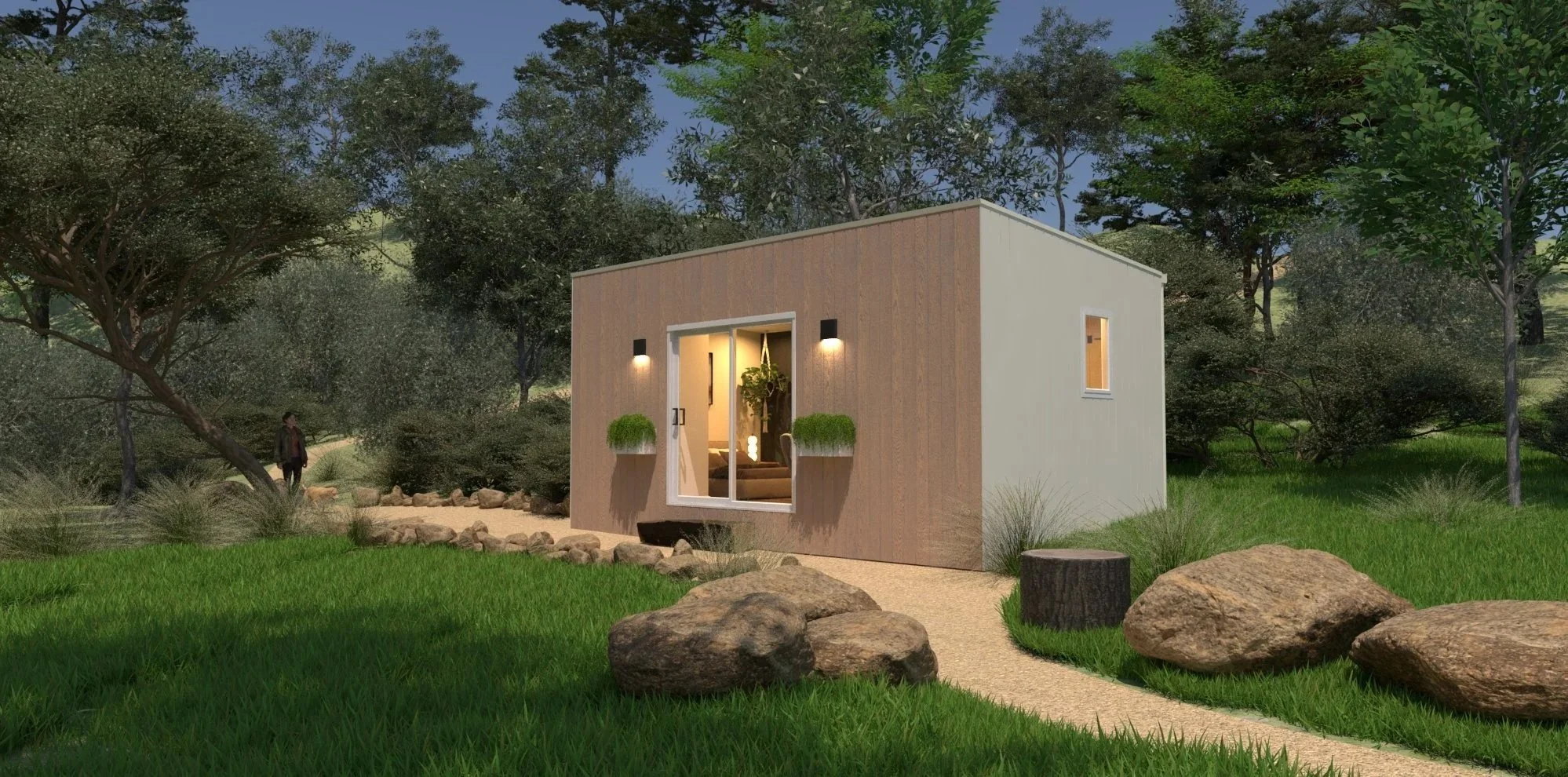 Small modern tiny house  or modular home with a beige and wood exterior, large glass sliding door, installed outdoor lights, surrounded by trees and rocks, situated in a natural landscape.