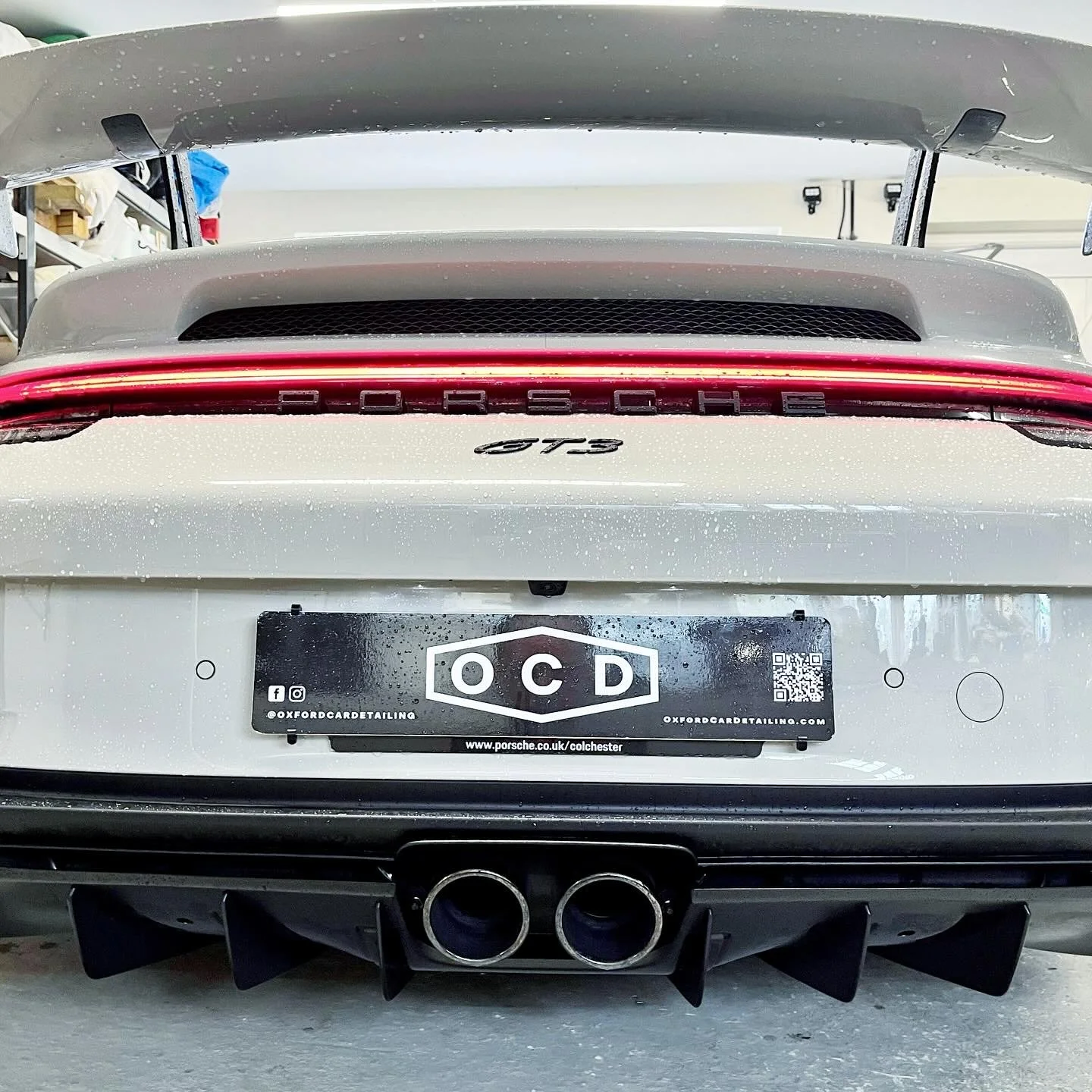Rear view of a silver Porsche 911 GT3 car after a full detail valet by Oxford Car Detailing.