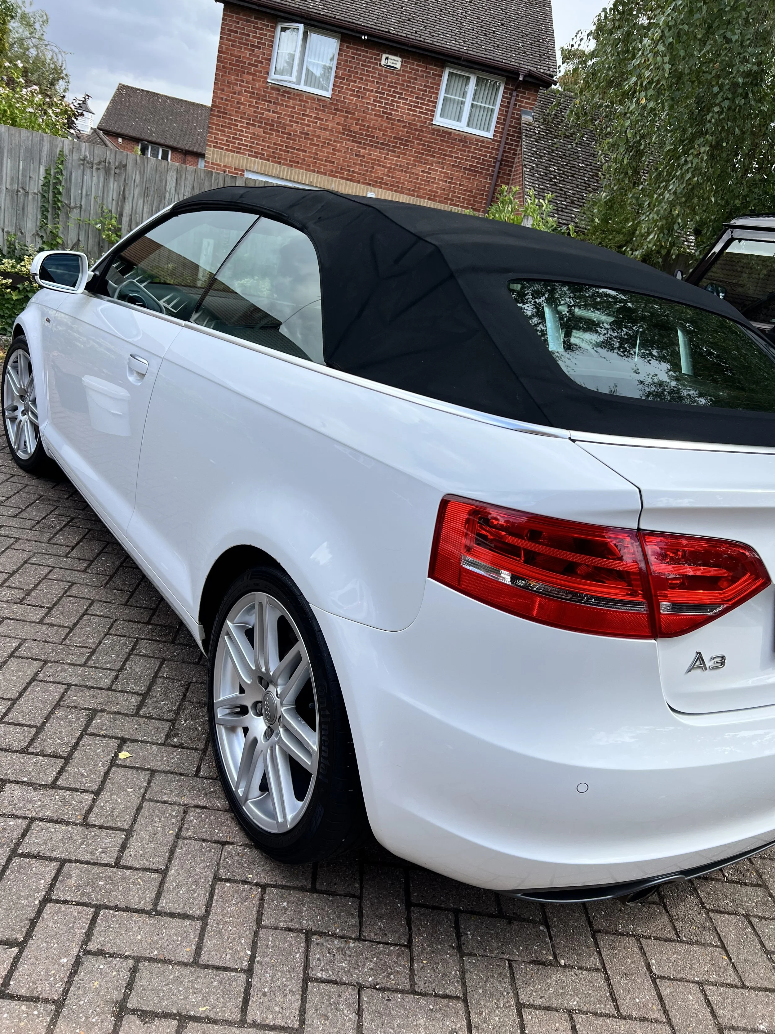 White Audi A3 convertible with a black soft top after a full detail valet by Oxford Car Detailing.