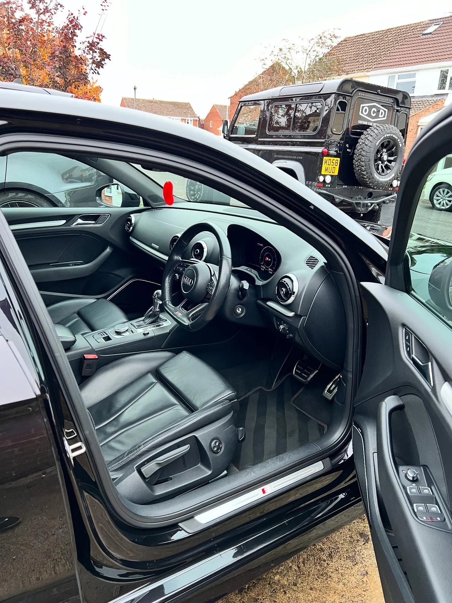 Interior of a black Audi vehicle after full valet and detail and ceramic coating.
