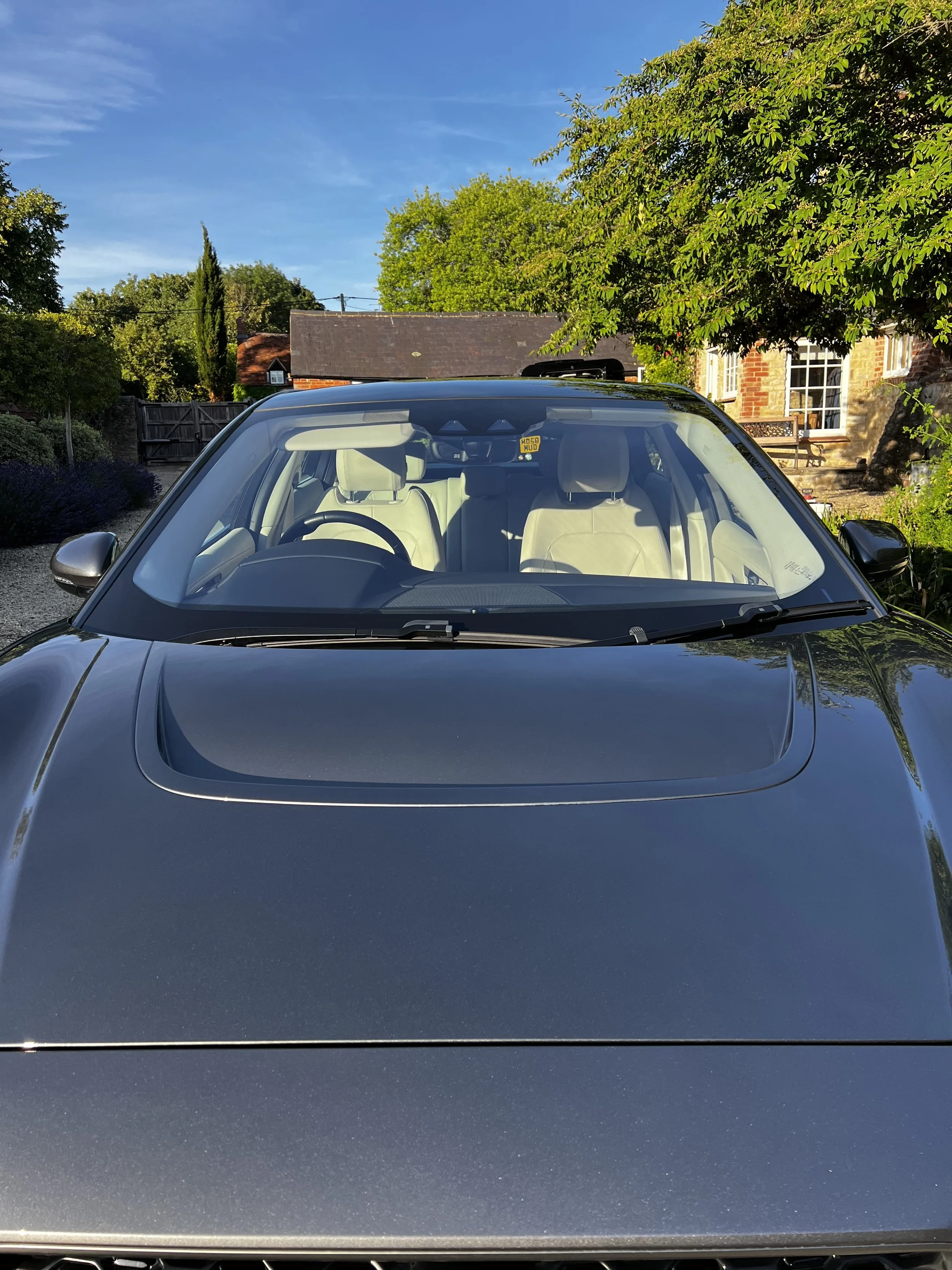 Front view of a silver car parked outdoors after full valet.