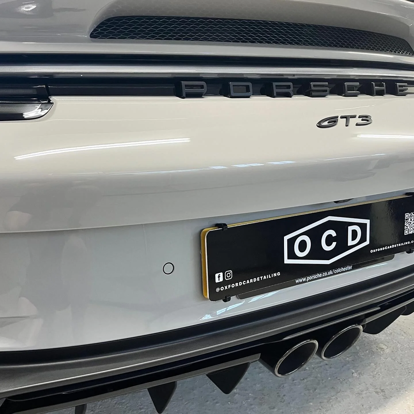 Close-up of the rear of a Porsche GT3 car after a full detail valet by Oxford Car Detailing.
