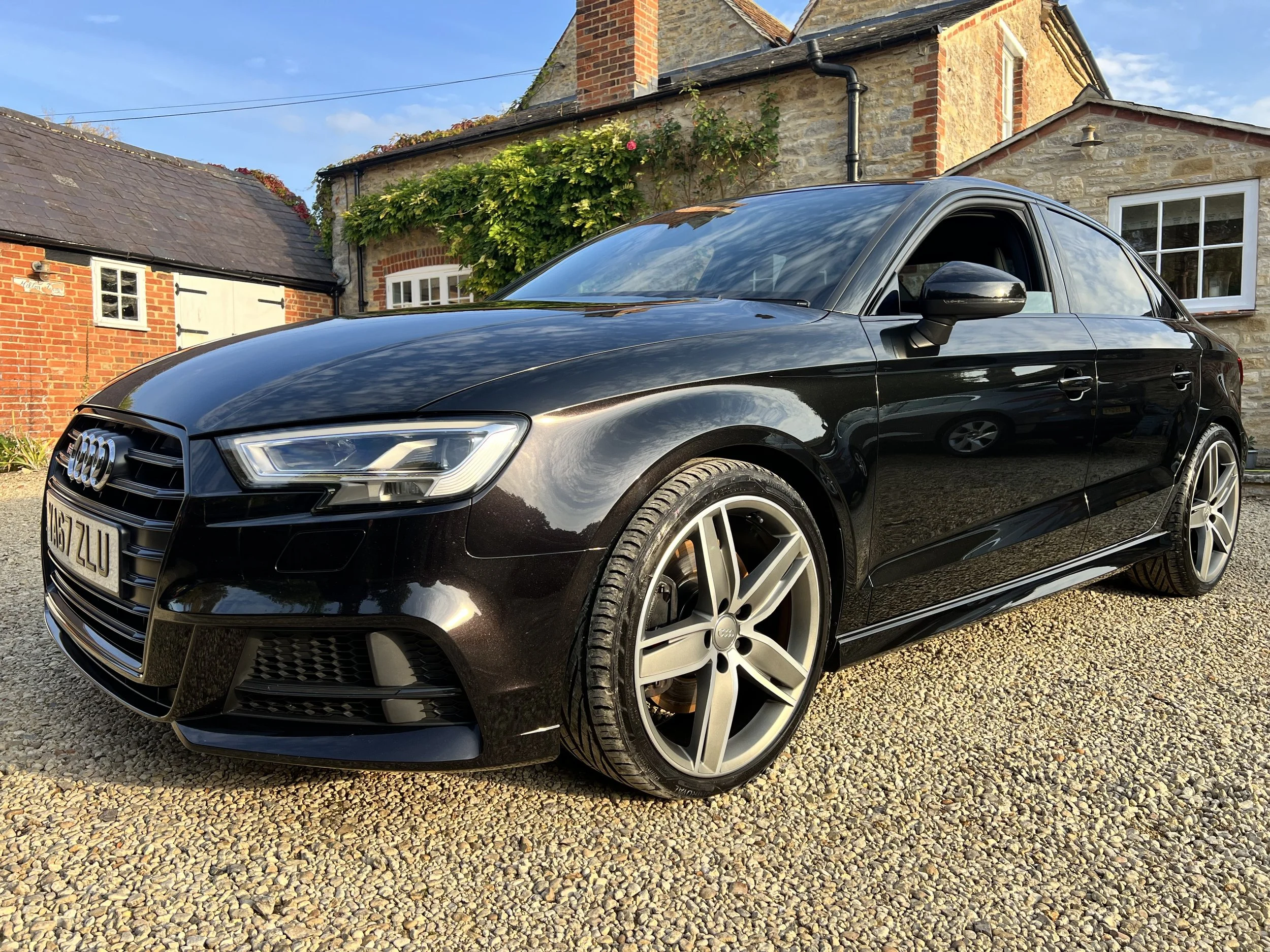A black Audi after full machine polish and 5 year ceramic coating.