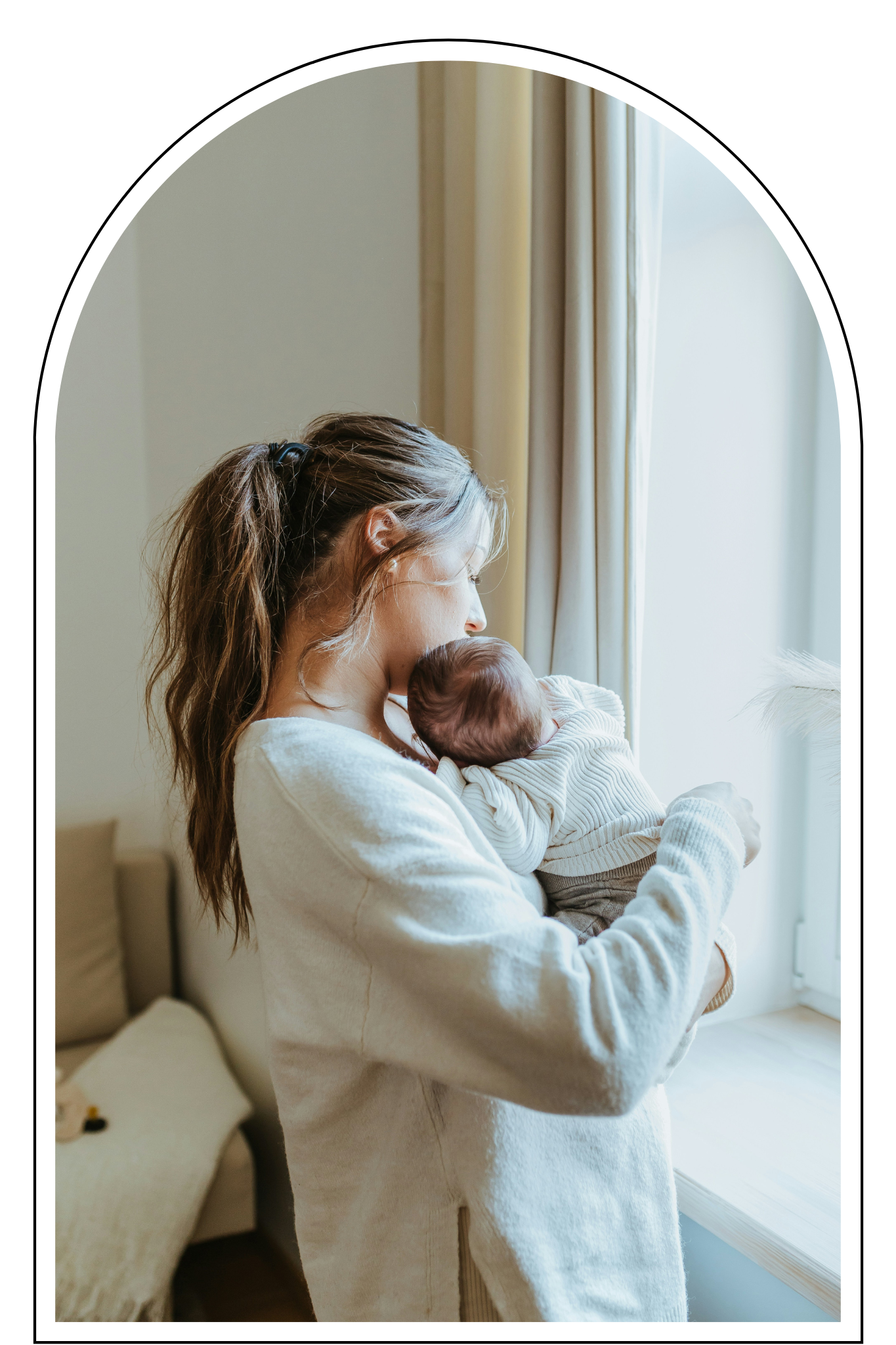 A mother holding a newborn looking lost