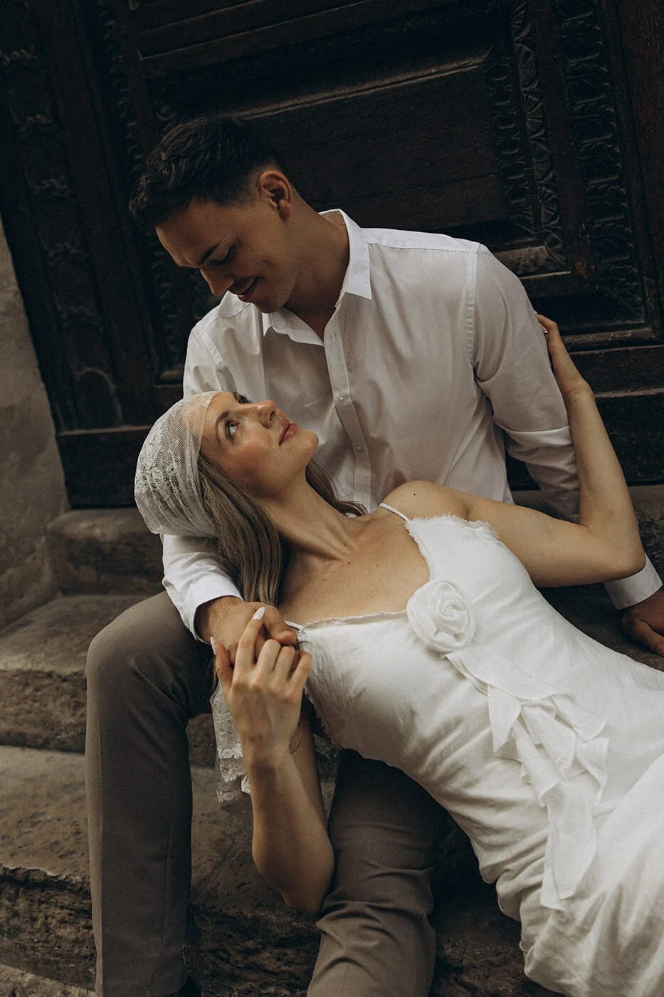 Intimate Paris elopement moment by the river, natural and emotional couple photography in a historic Paris setting.