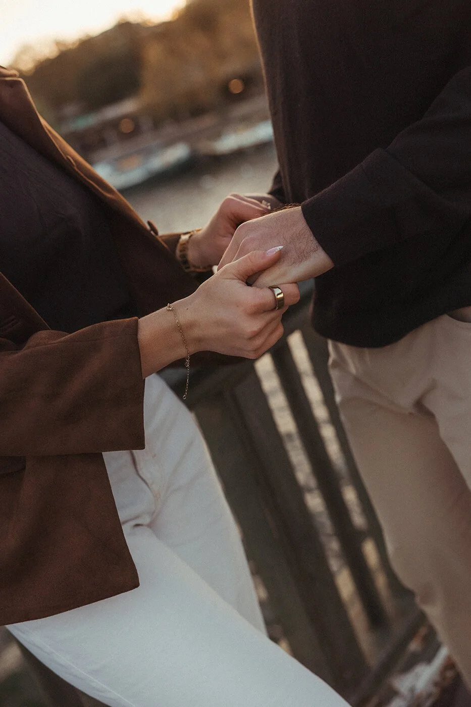Close-up detail shot of hands and engagement ring during a Paris couple session.