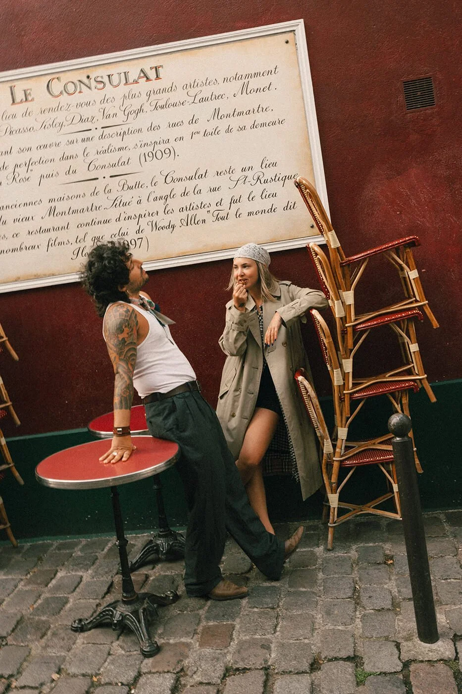 Engagement session at Le Consulat café in Montmartre, romantic Paris couple photos captured by a destination engagement photographer.