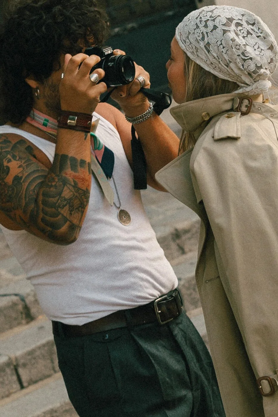 Playful moment for lovers taking pictures during engagement photoshoot in Paris.