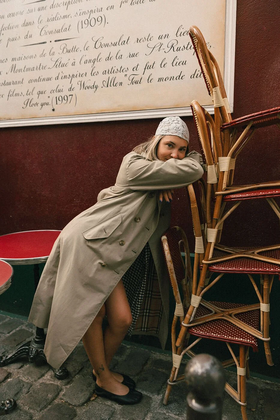 Close romantic portrait of a couple at a Paris café during their engagement session, soft light and authentic connection.