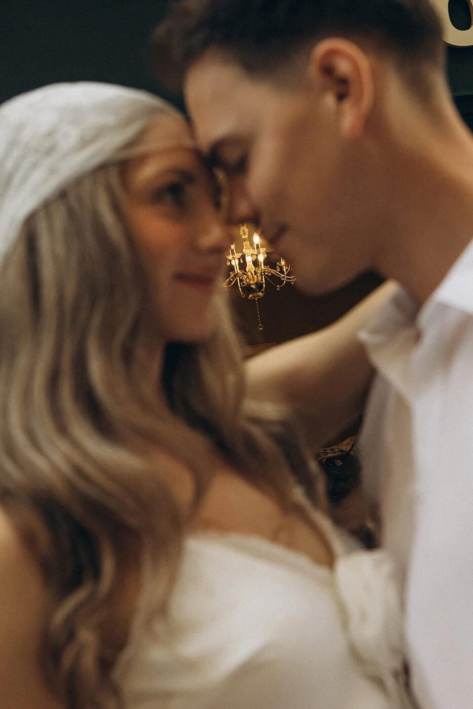 Close-up portrait of a stylish couple during their engagement session in Paris, romantic and cinematic photography in Ile Saint Louis.