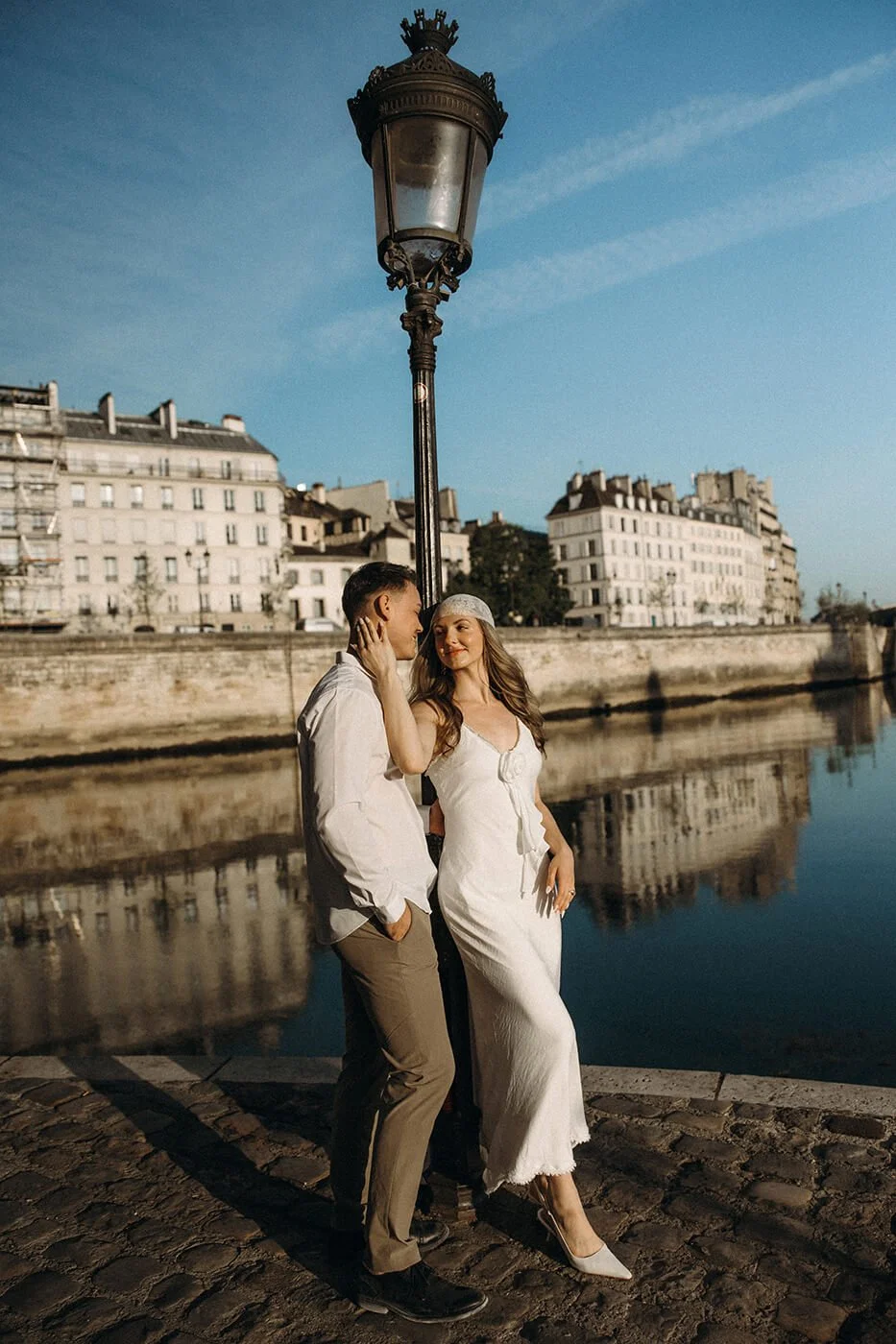 Timeless engagement photos in Paris with Seine River views and classic Parisian architecture in the background.