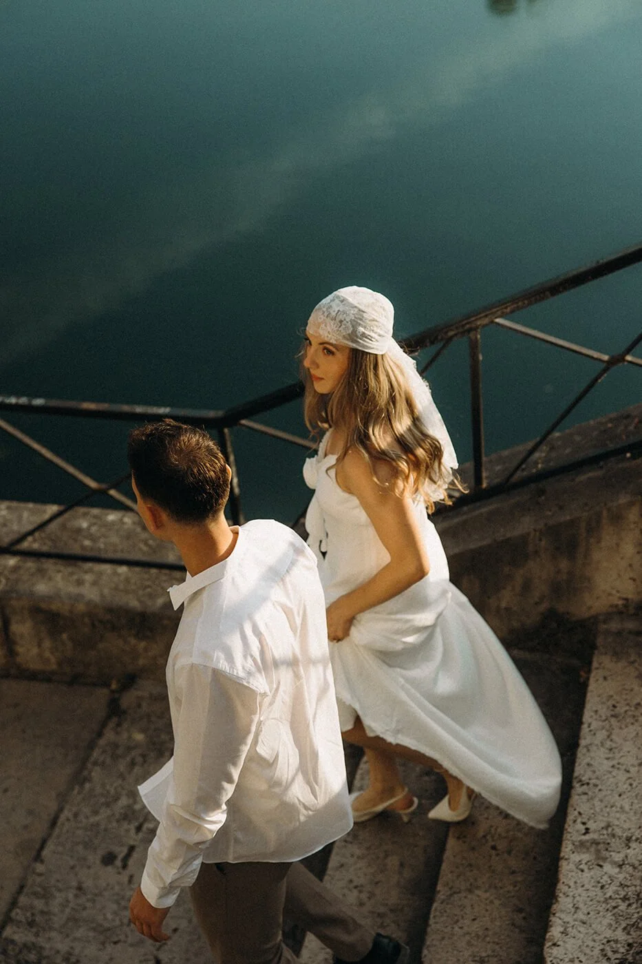 Intimate Paris elopement moment by the river, natural and emotional couple photography in a historic Paris setting.