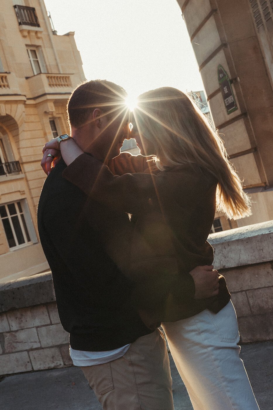 Intimate cinematic couple portrait in Paris captured in soft low light.