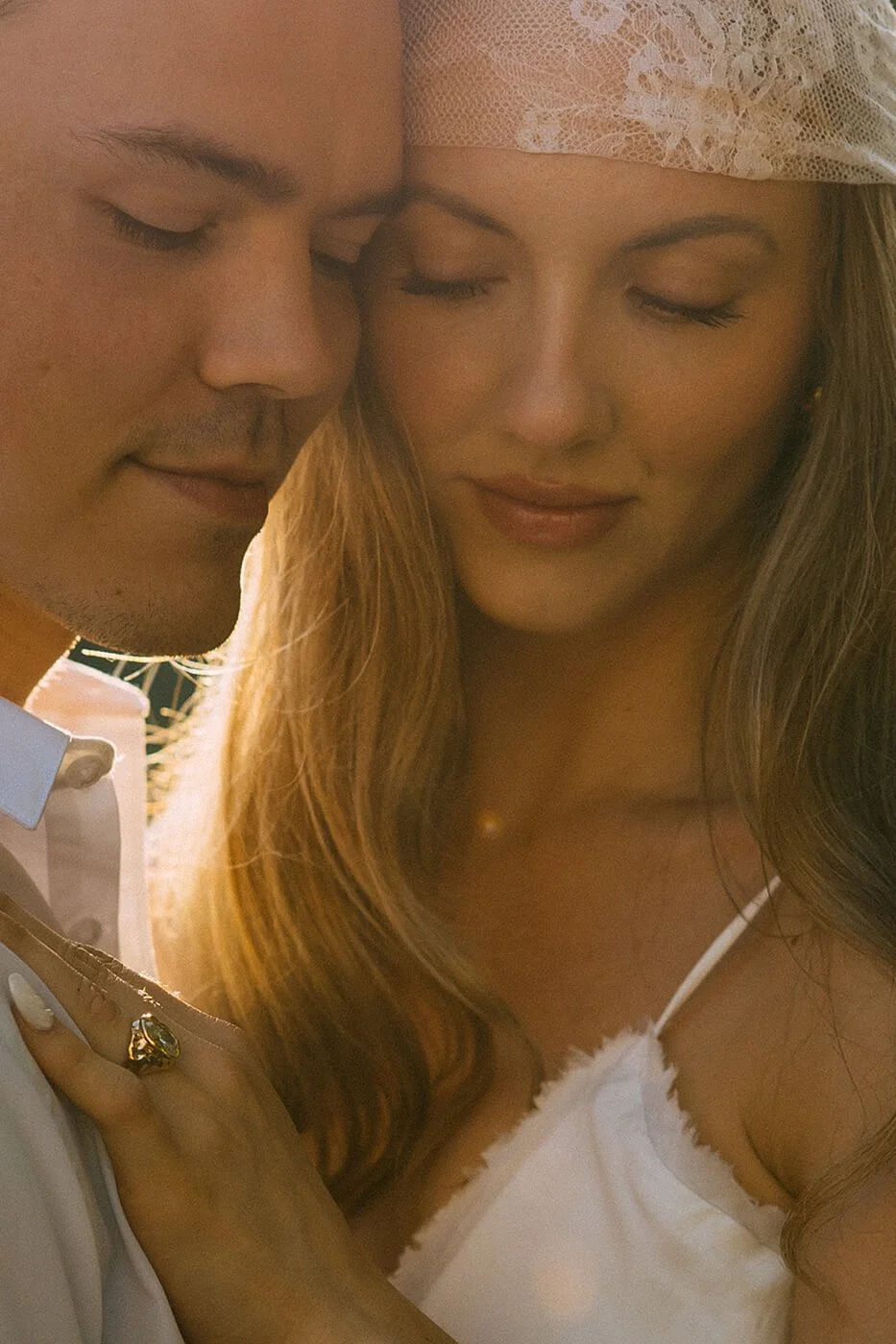 Sunset engagement session by the Seine River in Paris, peaceful and romantic couple photography in a cinematic style.