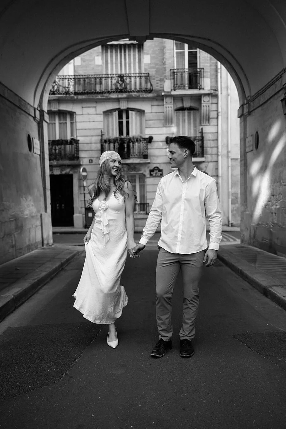 Candid couple walking on the streets, lifestyle engagement photography in the heart of Paris.
