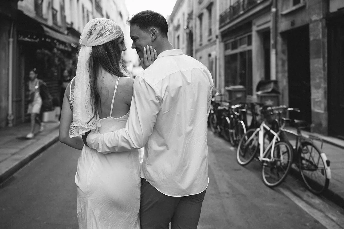 Candid couple walking on the streets, lifestyle engagement photography in the heart of Paris.