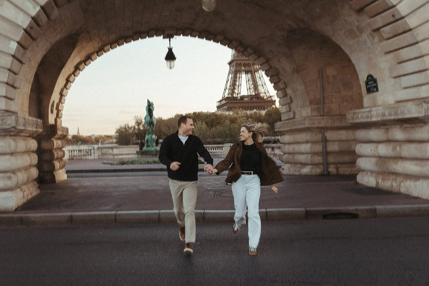 Relaxed candid portrait of a couple during a Paris street-style couple photoshoot.