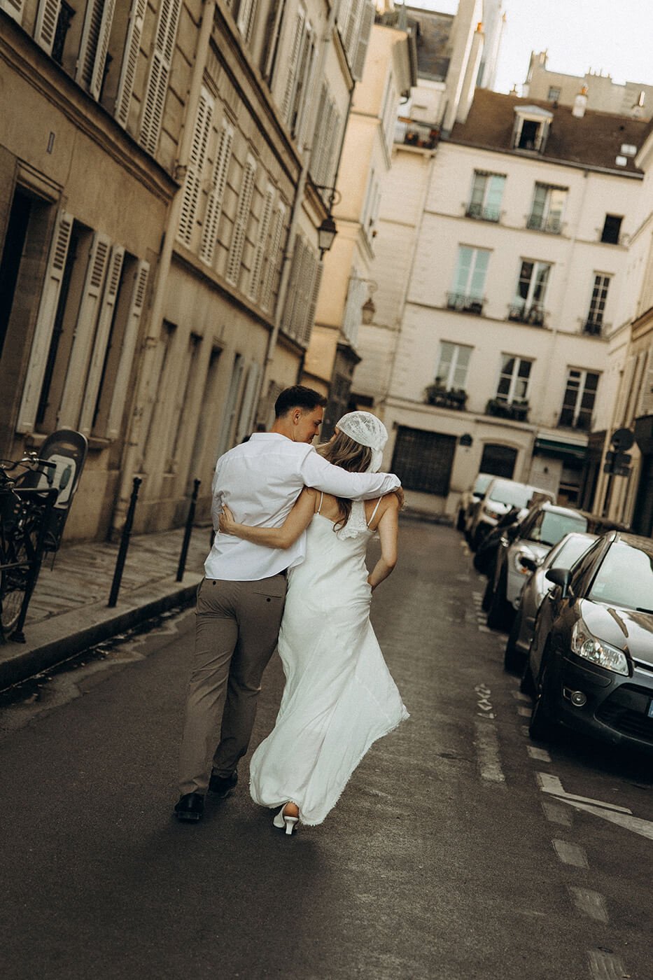 Candid couple walking on the streets, lifestyle engagement photography in the heart of Paris.
