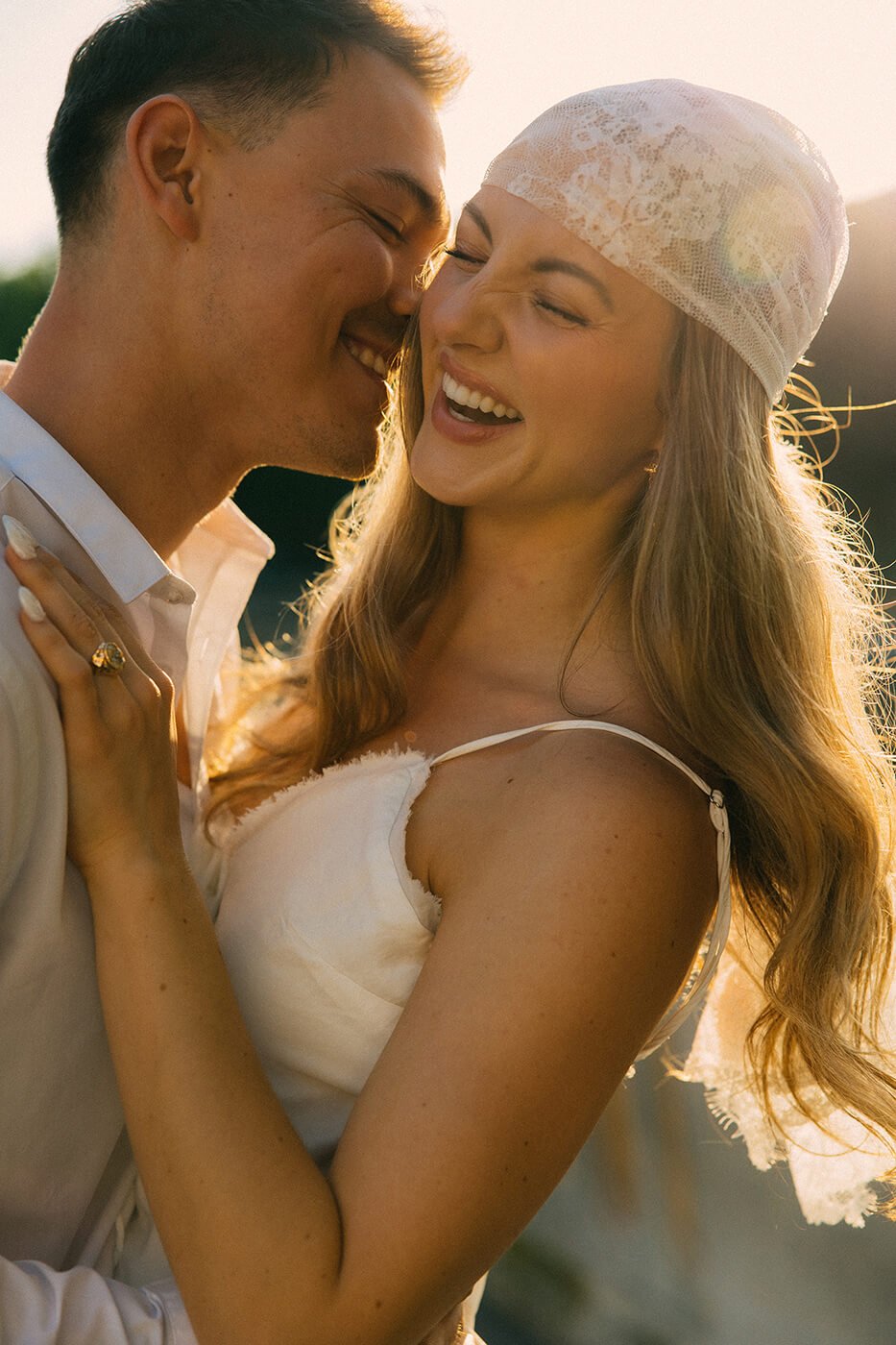 Elegant couple embracing by the Seine River during their engagement session in Paris, soft light and timeless destination photography.