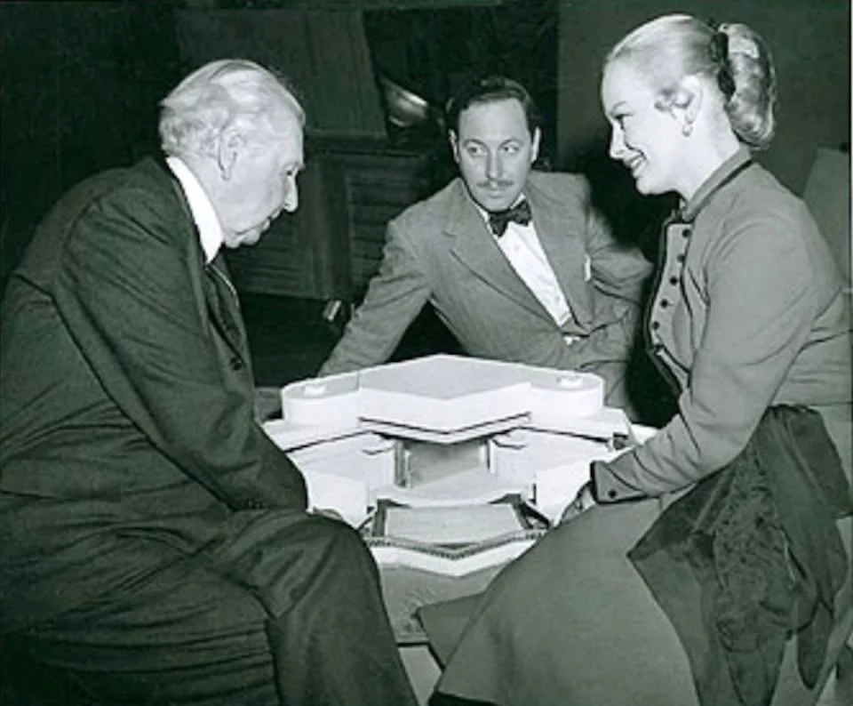 Frank Lloyd Wright, Tennessee Williams and Faye Emerson review the model for the New Theater.
