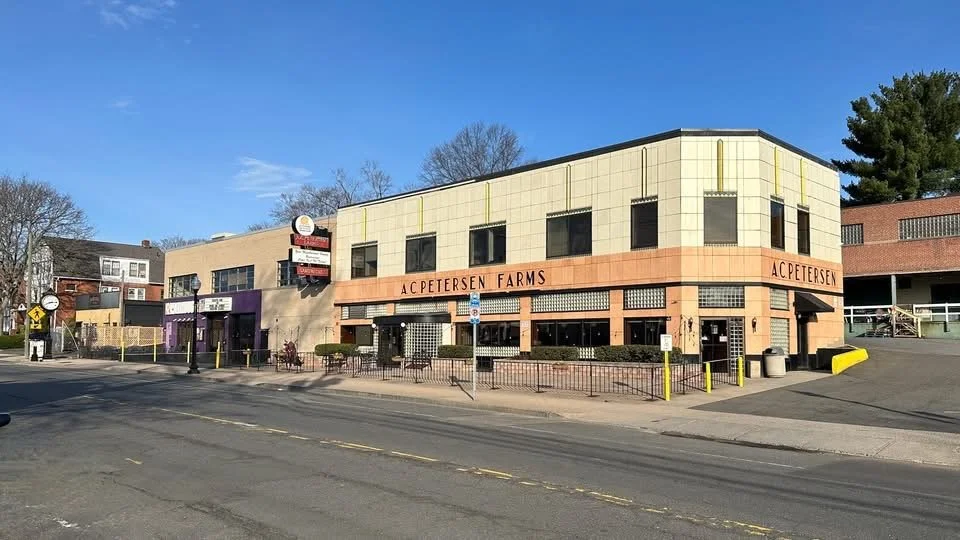 1921- Aquires 238-248 Park Road and begins processing milk into retail dairy products 