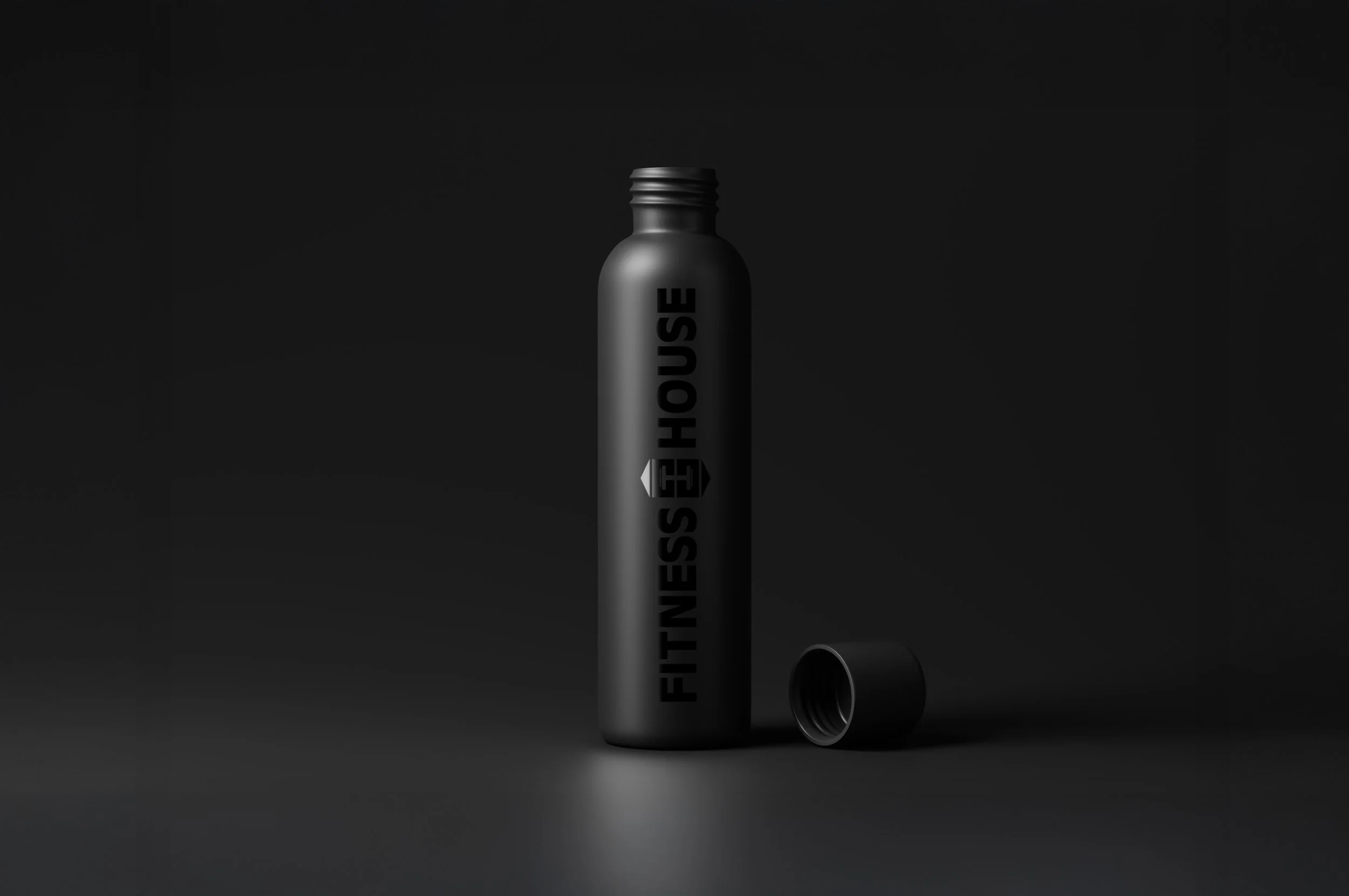 A black matte bottle with the words "FITNESS HOUSE" written vertically on it, set against a dark background. The bottle has a sleek, modern design and appears to be a cosmetic or fragrance product.