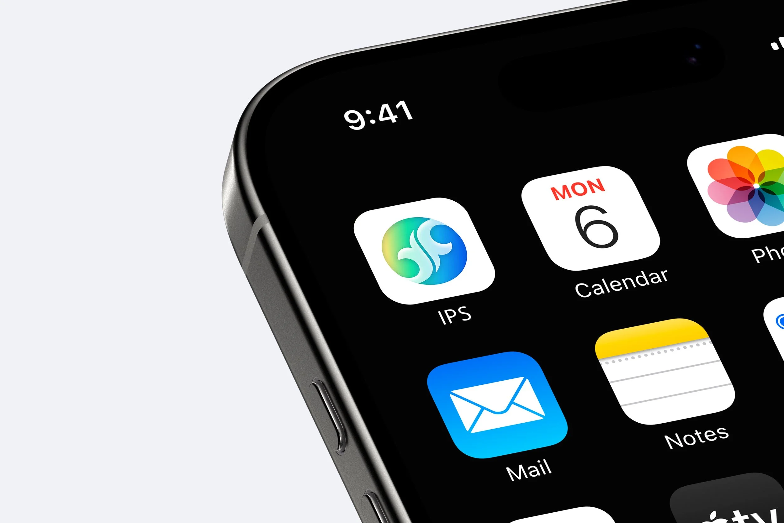 Close-up of an iPhone screen displaying app icons including Calendar, Photos, Mail, and Notes, with the time 9:41 at the top.