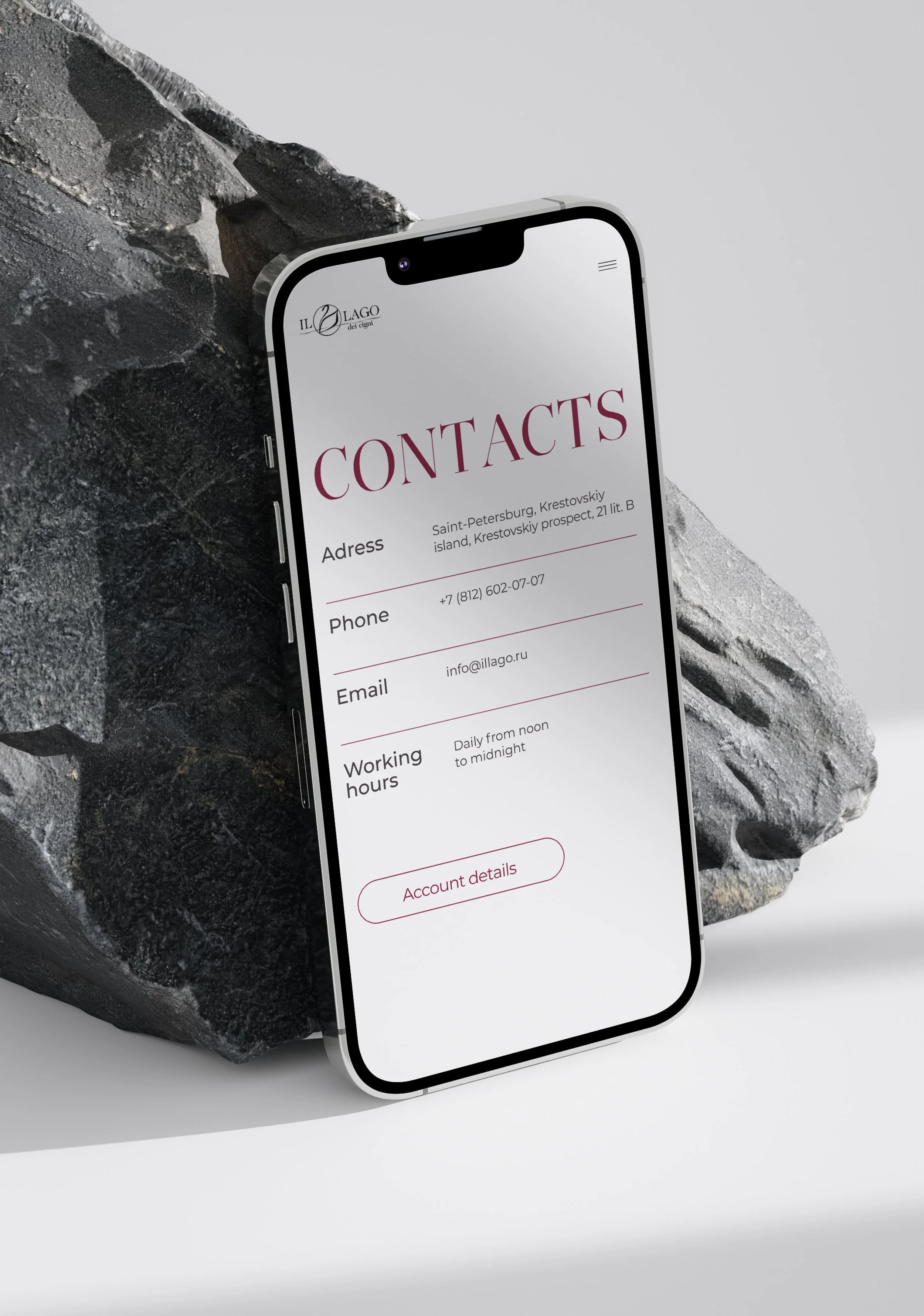 A smartphone displaying a contact information form on a gray and black textured surface.