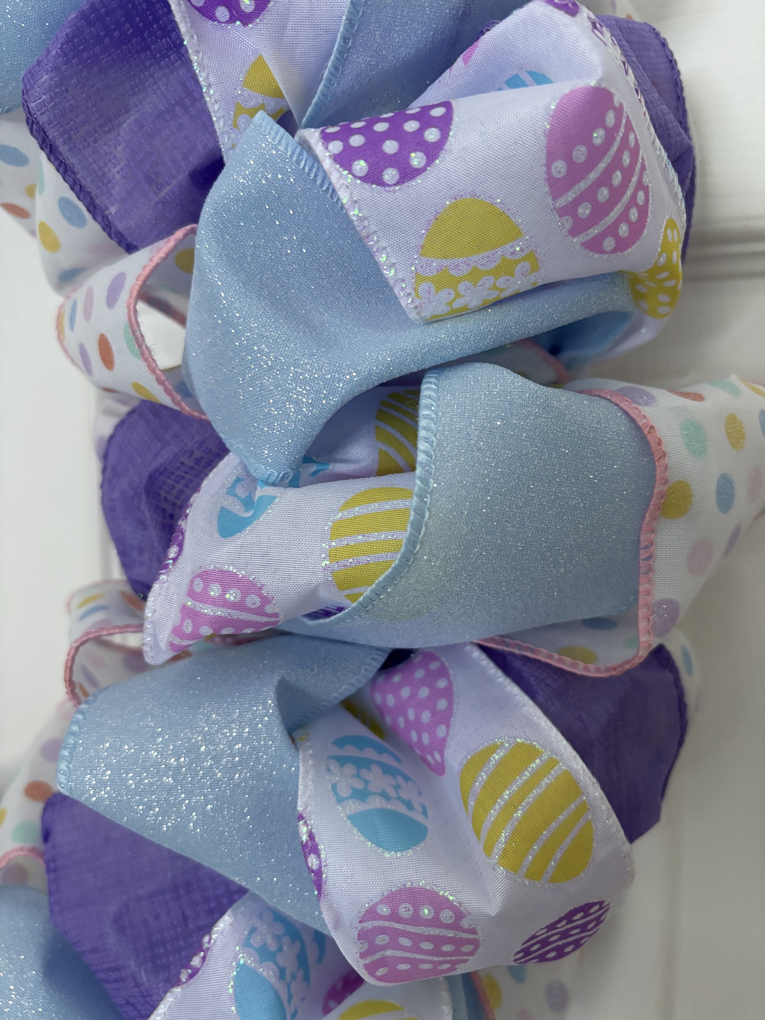 White, Purple Blue with Easter Eggs Ribbon Wreath Close View.JPG