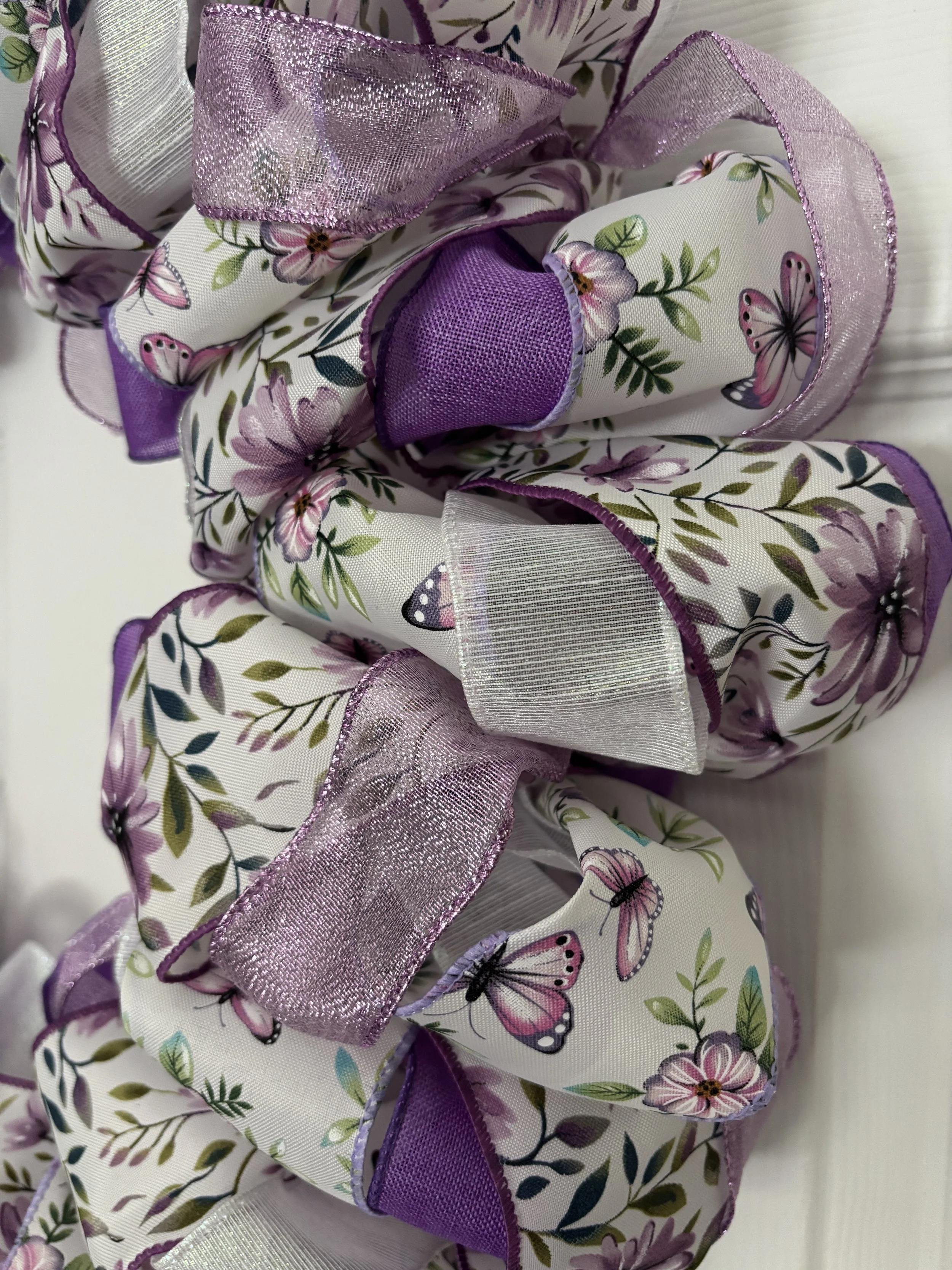 White and Purple Ribbon Wreath with Flowers Close View.JPG