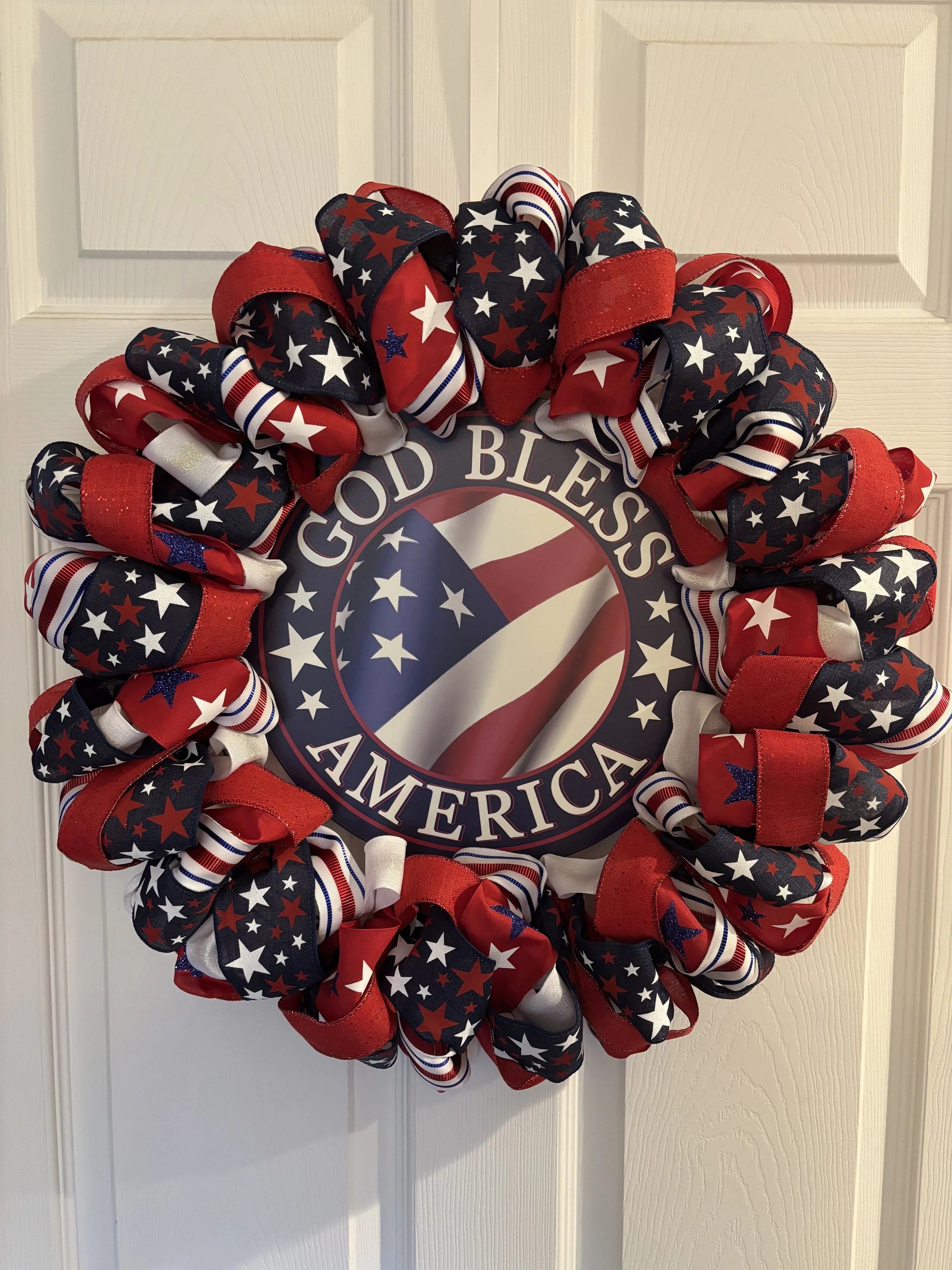 Patriotic Red, White, and Blue Ribbon Wreath with God Bless America Sign
