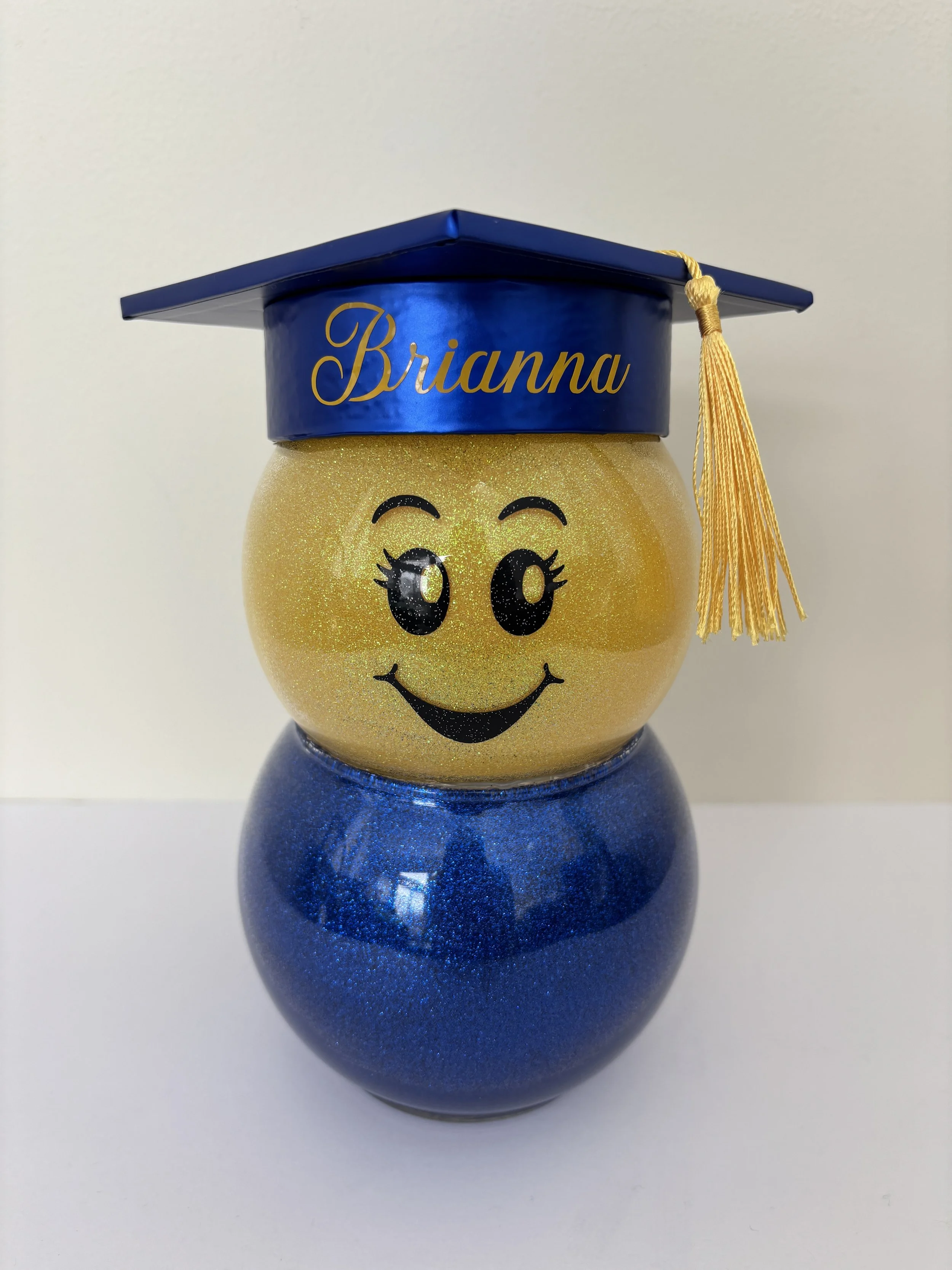 Blue and Yellow Female Graduate Front View.JPG