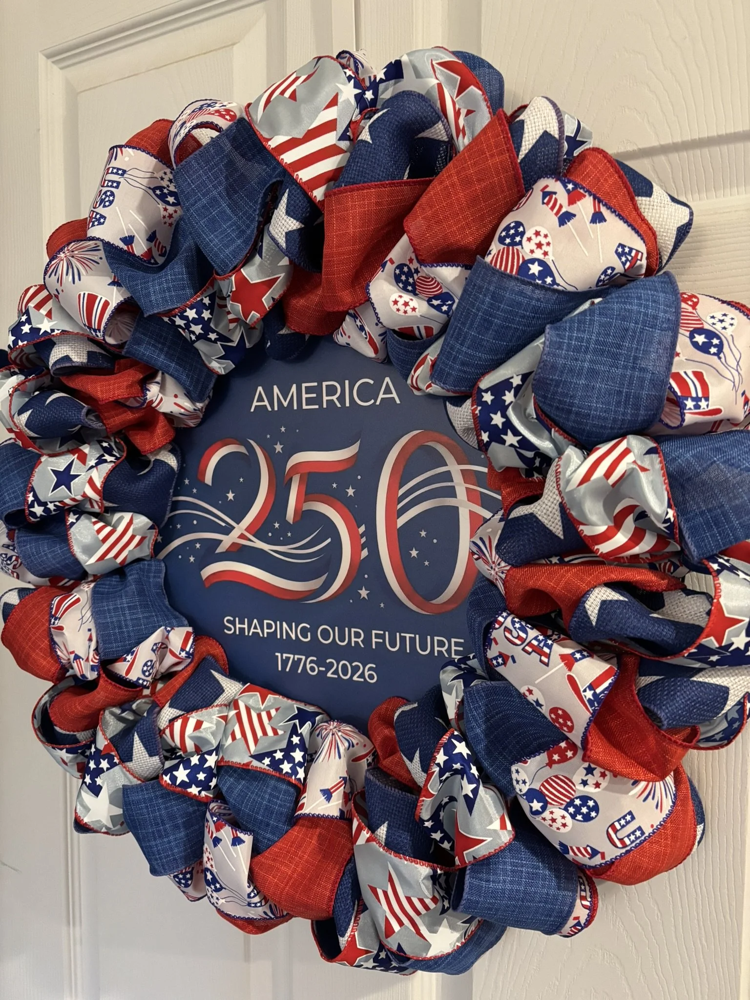 Red, White and Blue Ribbon Wreath with Blue 250th Anniversary Sign Right View.JPEG