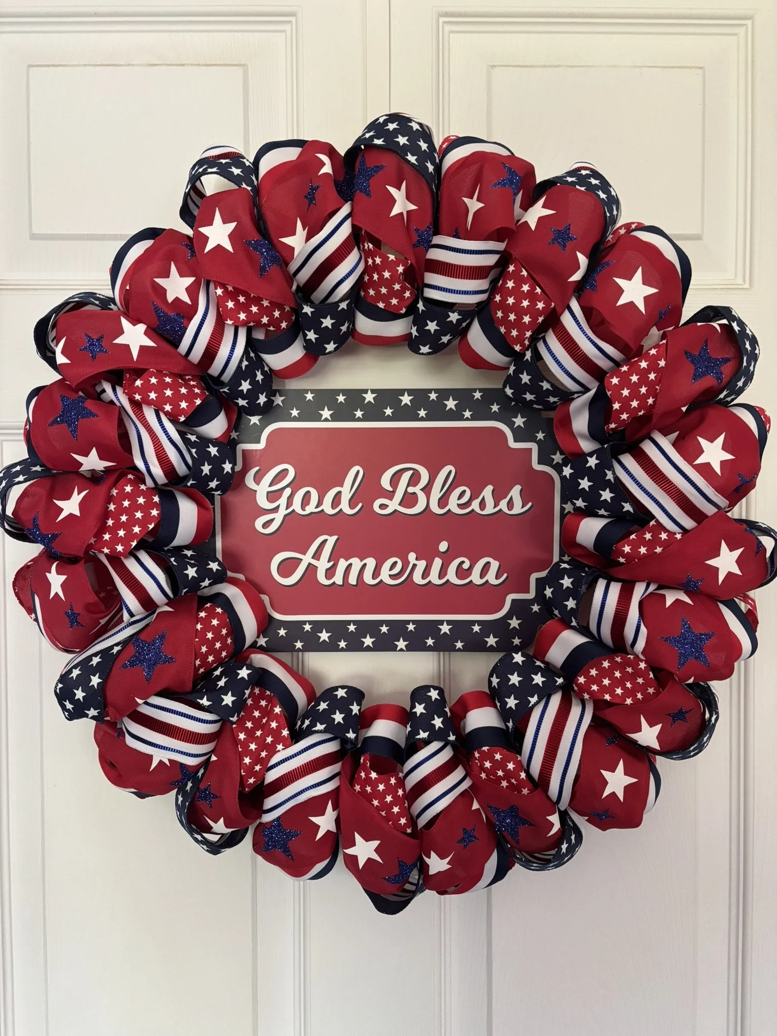 Patriotic Red, White and Blue Ribbon Wreath with 'God Bless America' Sign