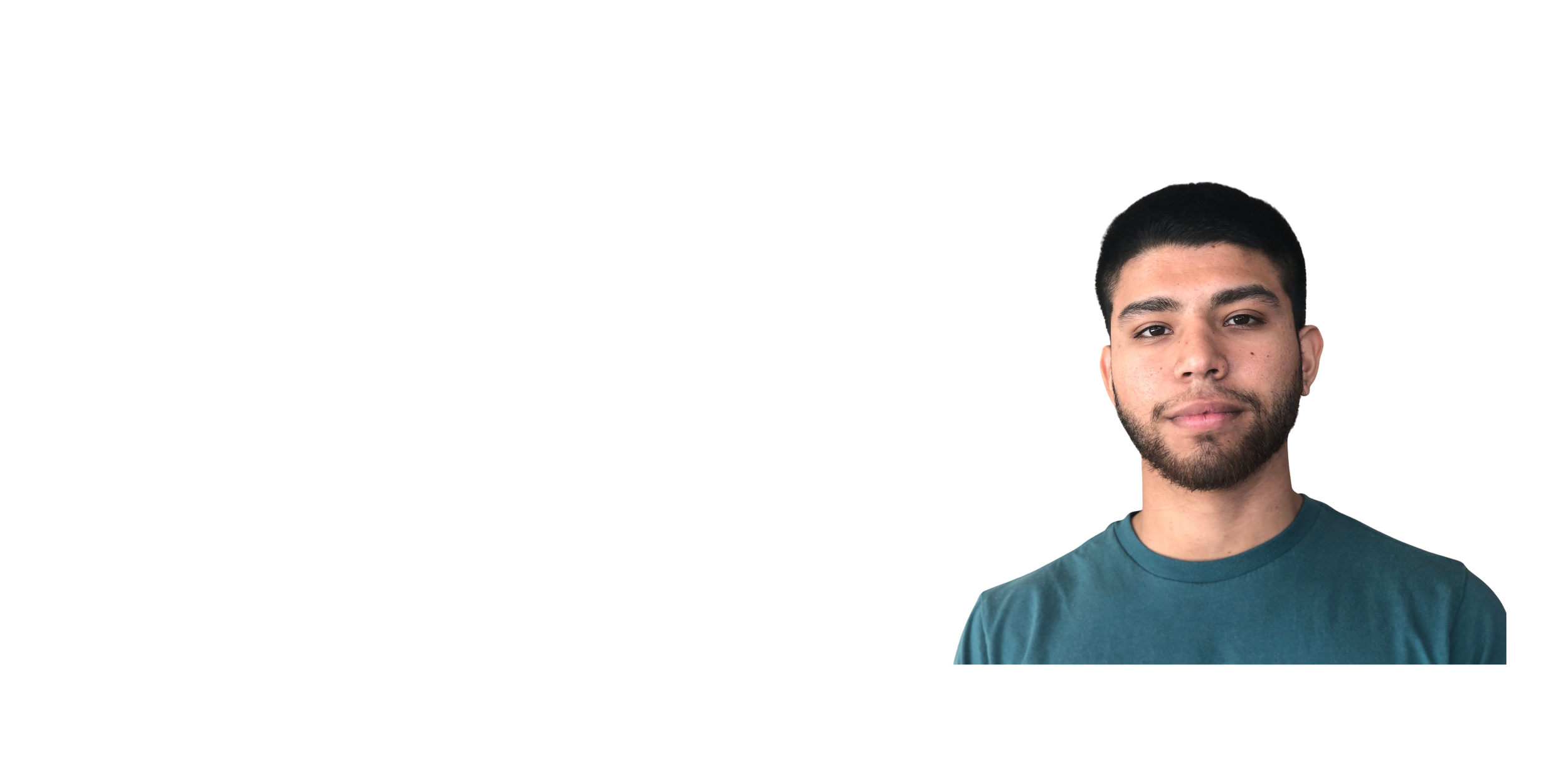 A man with short dark hair and a beard, wearing a teal t-shirt, looking at the camera with a neutral expression, against a plain white background.