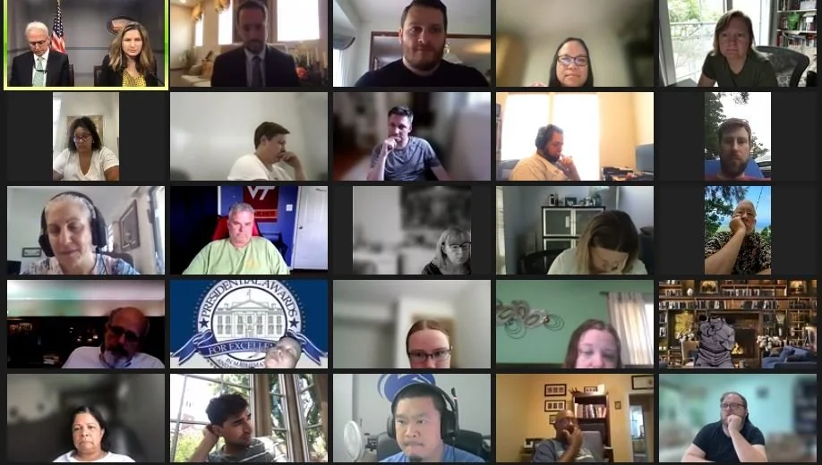 A screenshot of a virtual meeting with multiple participants displayed in a grid, some with backgrounds of bookshelves, offices, or homes.