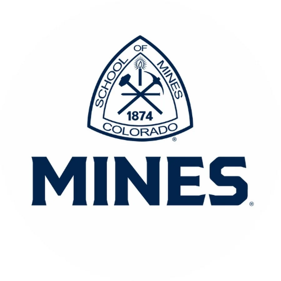 Logo of the Colorado School of Mines featuring a shield with mining tools and the year 1874, and the word "MINES" beneath it.