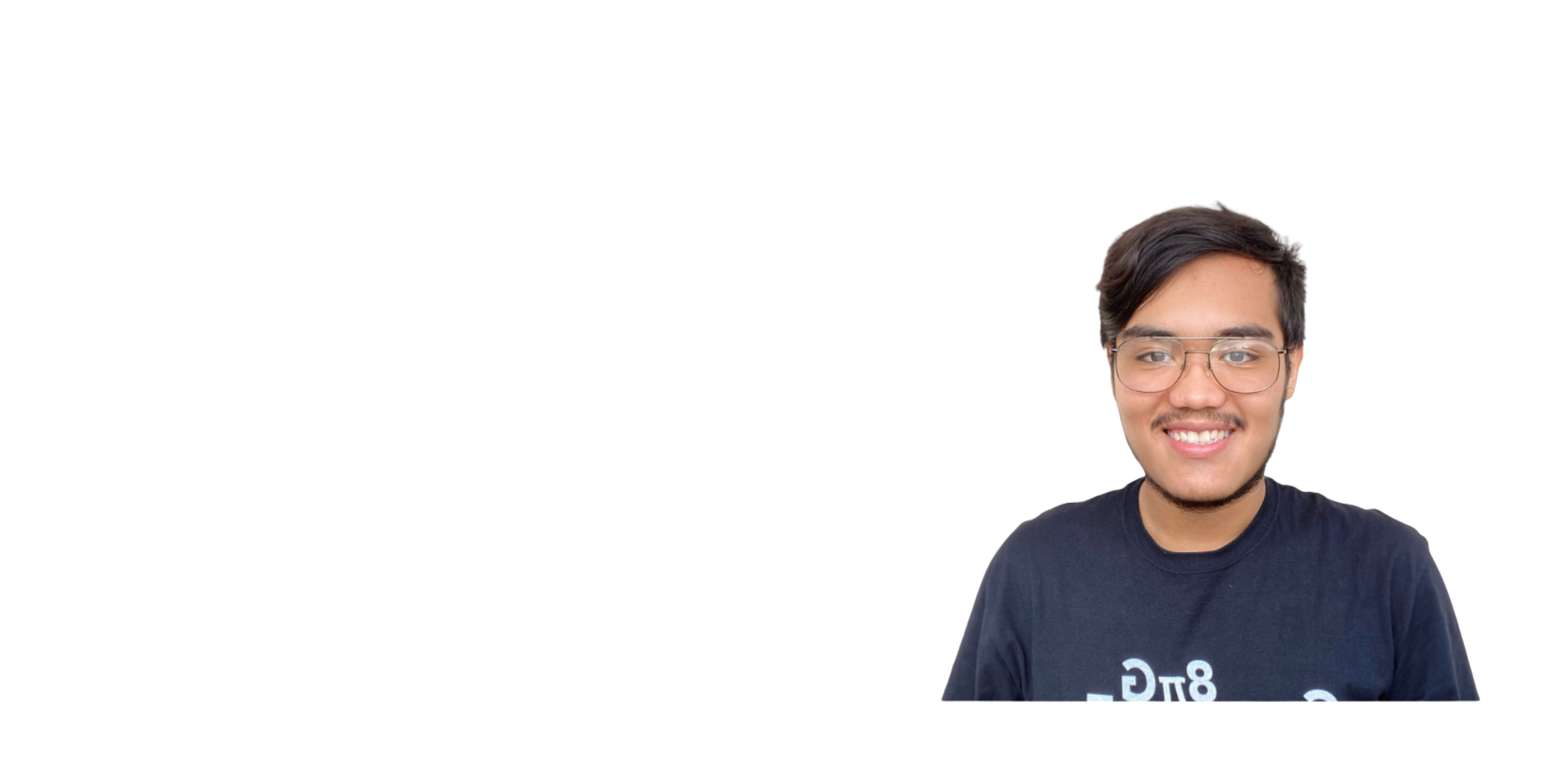 A young man with dark hair, glasses, and a mustache wears a dark T-shirt and smiles while looking at the camera against a plain white background.