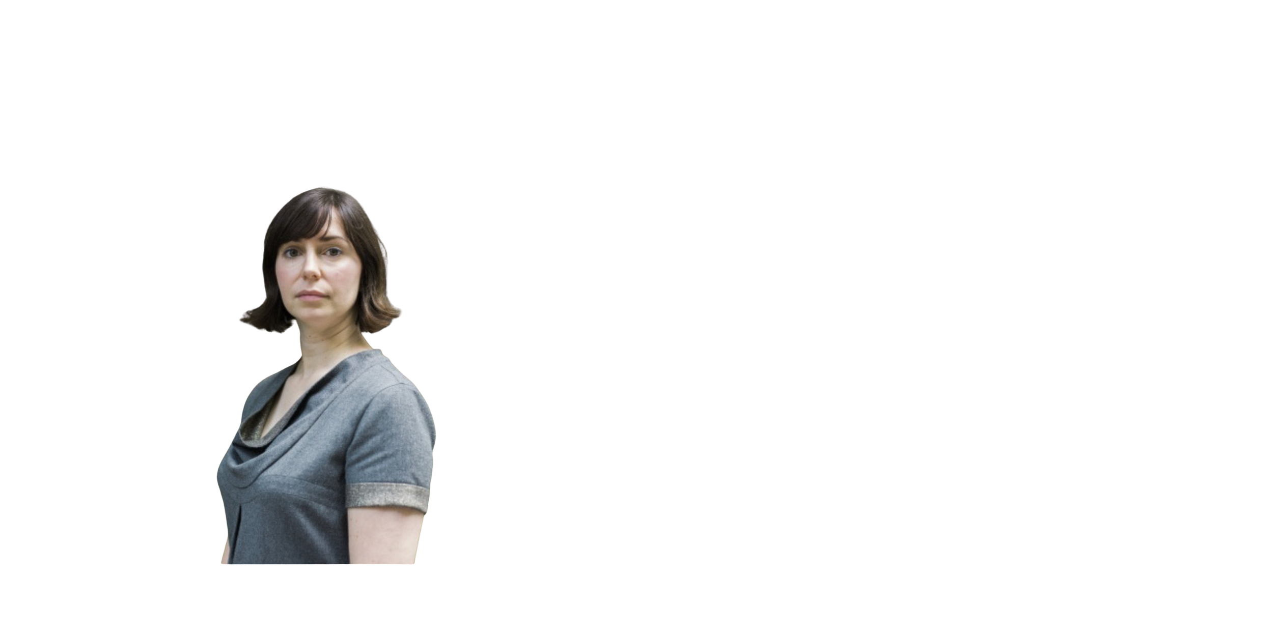 A woman with short brown hair and a gray shirt looks at the camera against a white background.