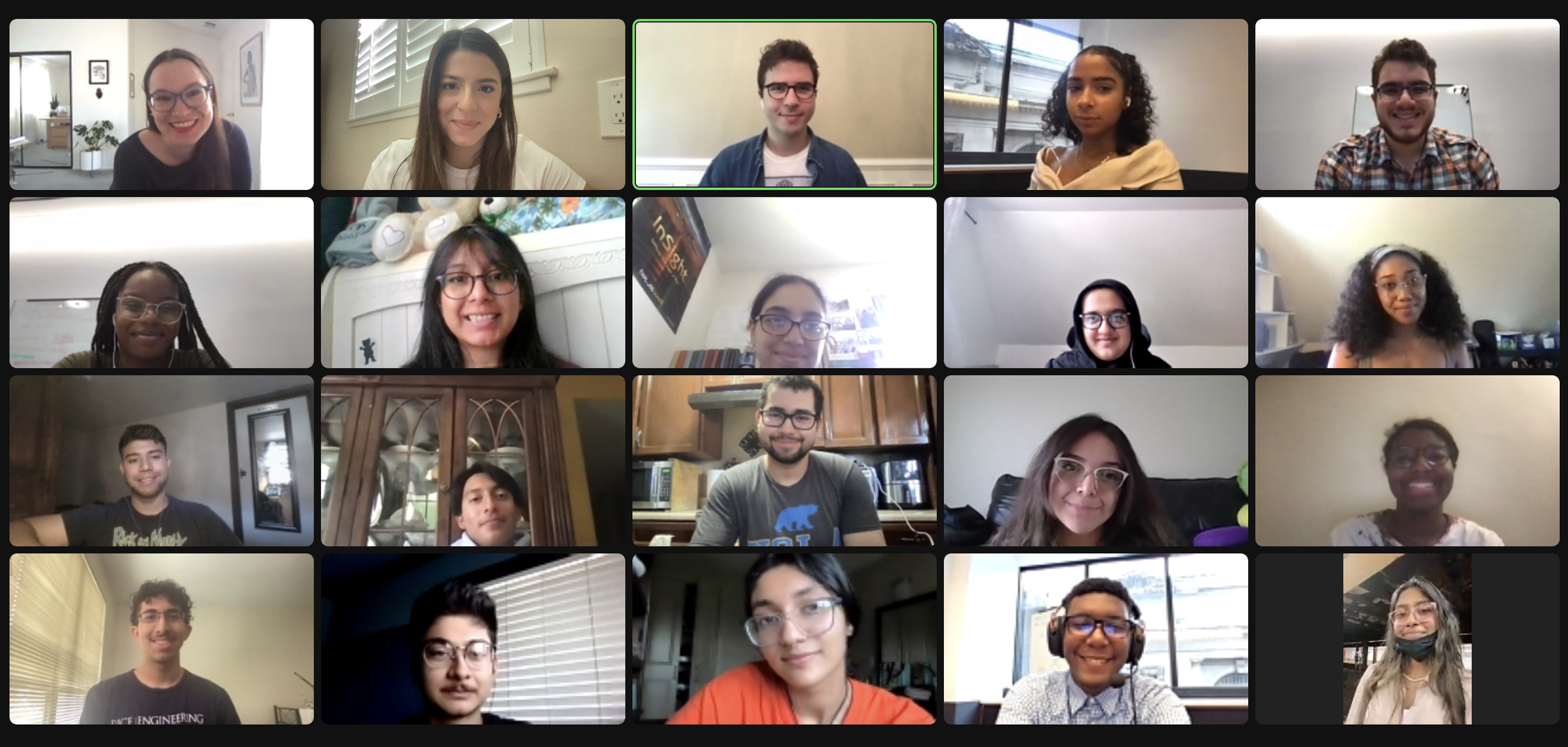 Zoom video conference with 20 diverse participants, some smiling, in various home office and living room settings.